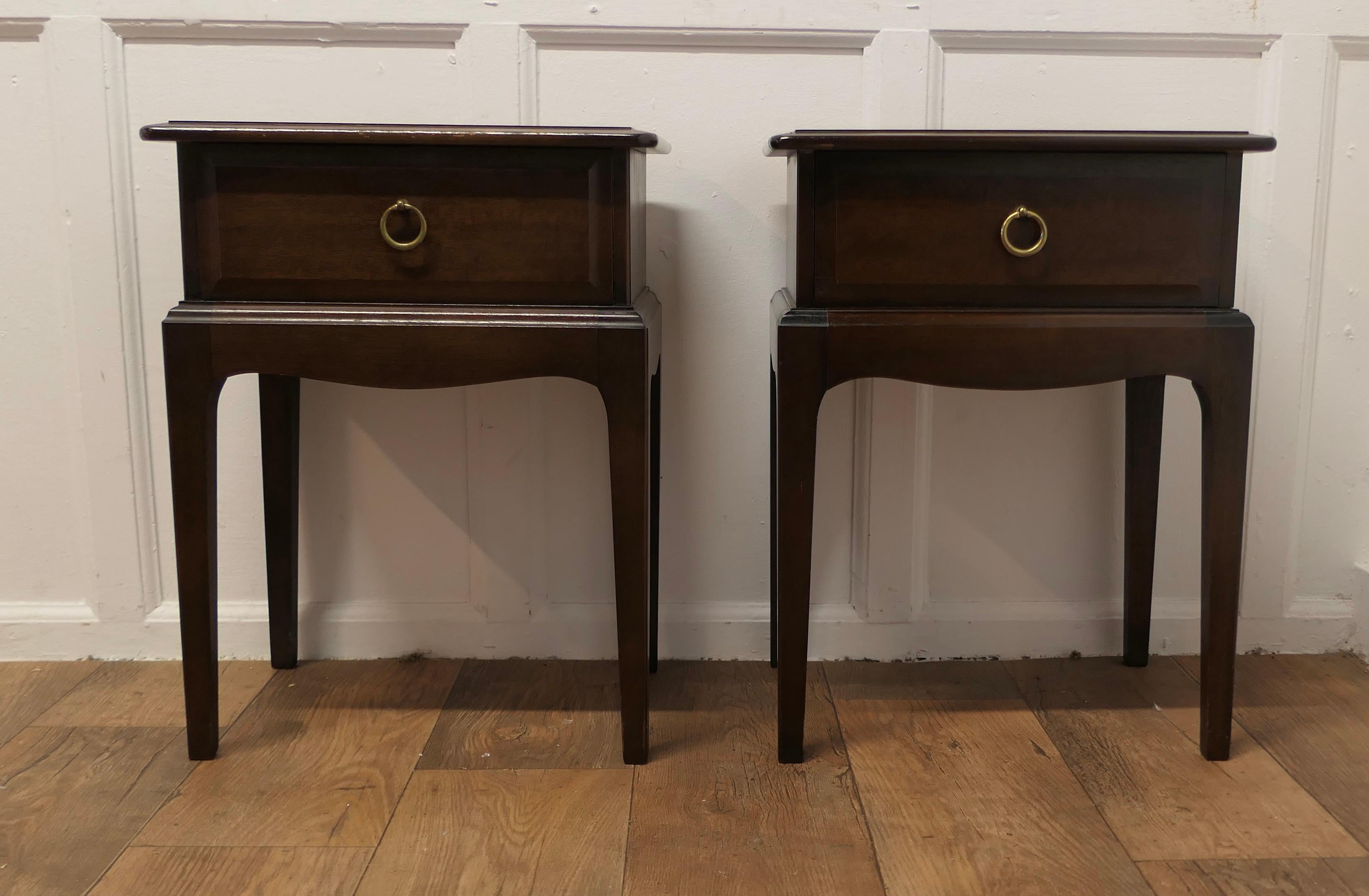 A Pair of Georgian Style Night Tables Bedside Cabinets

These neat cabinets each have a moulded top and a deep drawer, they stand on sturdy square tapering legs with a scalloped apron
The Cabinets are in good condition they are 18” wide, 23” tall