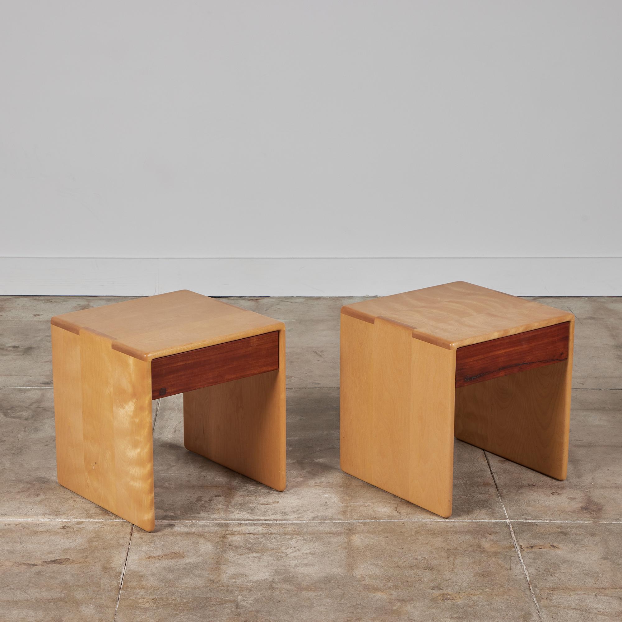 Nightstands by Gerald McCabe for Eon Furniture, c.1997, USA. The nightstands feature a maple surface and waterfall sides with beautiful finger joinery. The flat drawer fronts showcase shedua wood.

Dimensions
17