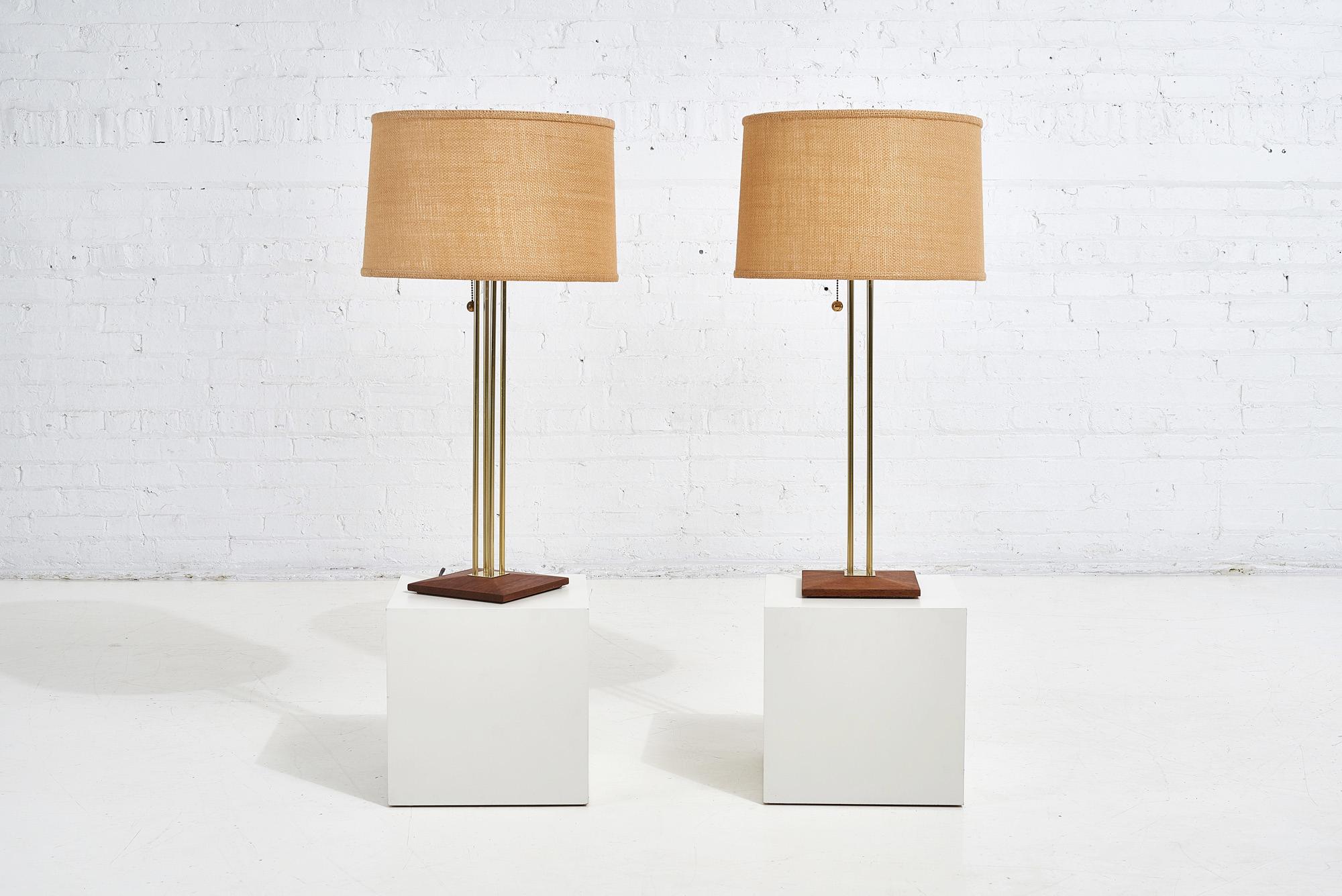 Pair of Gerald Thurston for Lightolier table lamps, 1950. Brass and walnut lamps by Gerald
Thurston. Shades are original and lamps are fully restored and refinished.