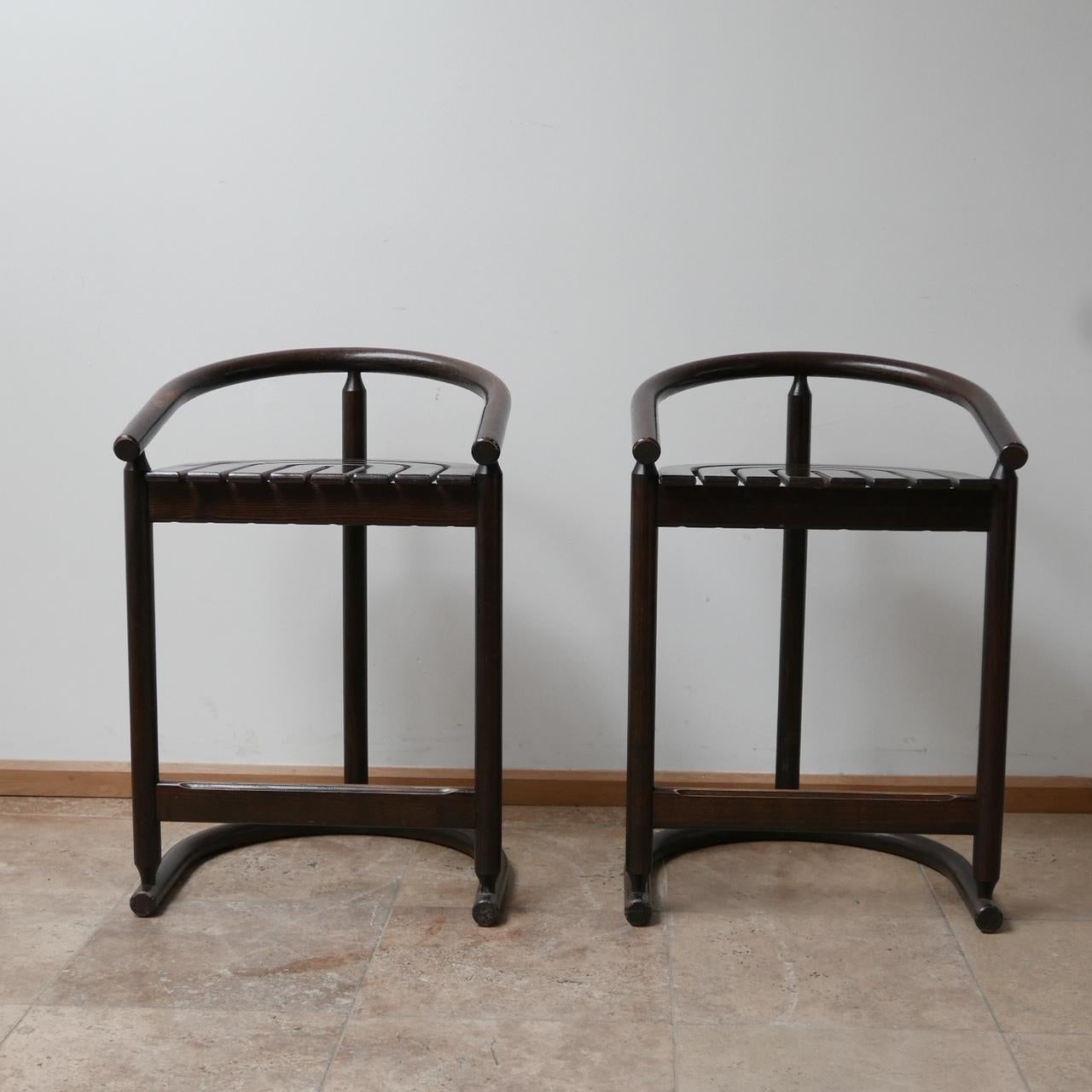 A good looking pair of bentwood bar stools,

German, c1980s. 

Radial form seats formed from four slats. 

Good condition, some small scuffs and nicks commensurate with age. 

Dimensions: 54 W x 48 D x 65 seat height x 80 total height in