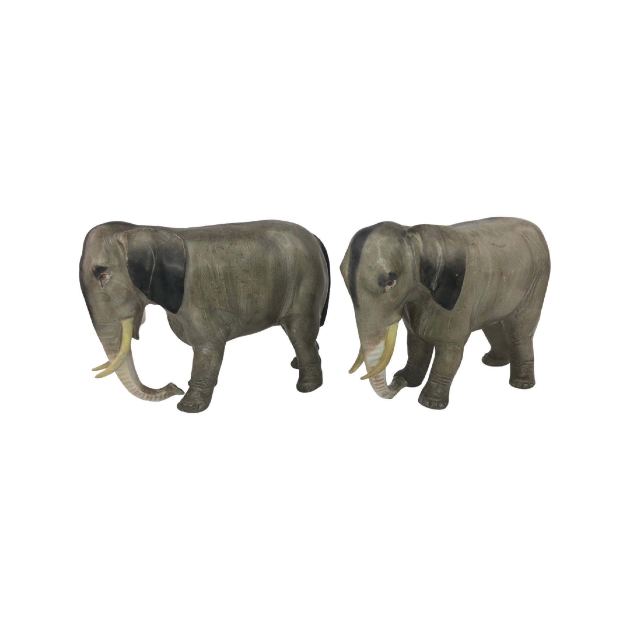Two German 1920s German Porcelain Elephants.

These pair in the classic gray coloration with a black streak running along the back. Both figures are in very good vintage condition with no chips or crack. These pair would make a great decorative