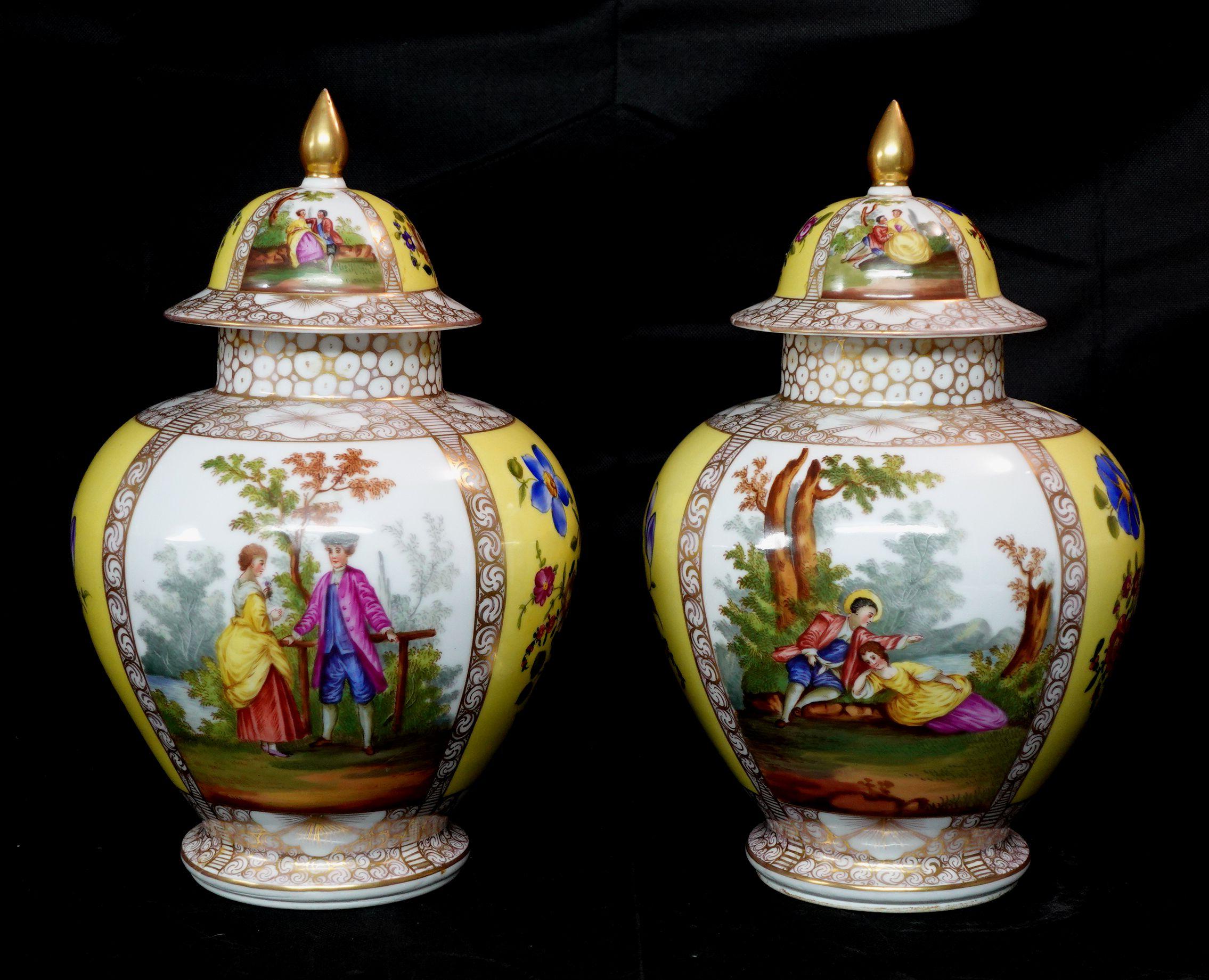 Pair of German Helena Wolfsohn style porcelain covered jars 19th century
Hand-painted covered porcelain jars, with scenes of a courting couple, bouquets of flowers, and gilt decoration, height 13, 
diameter 8 1/2 in.

 