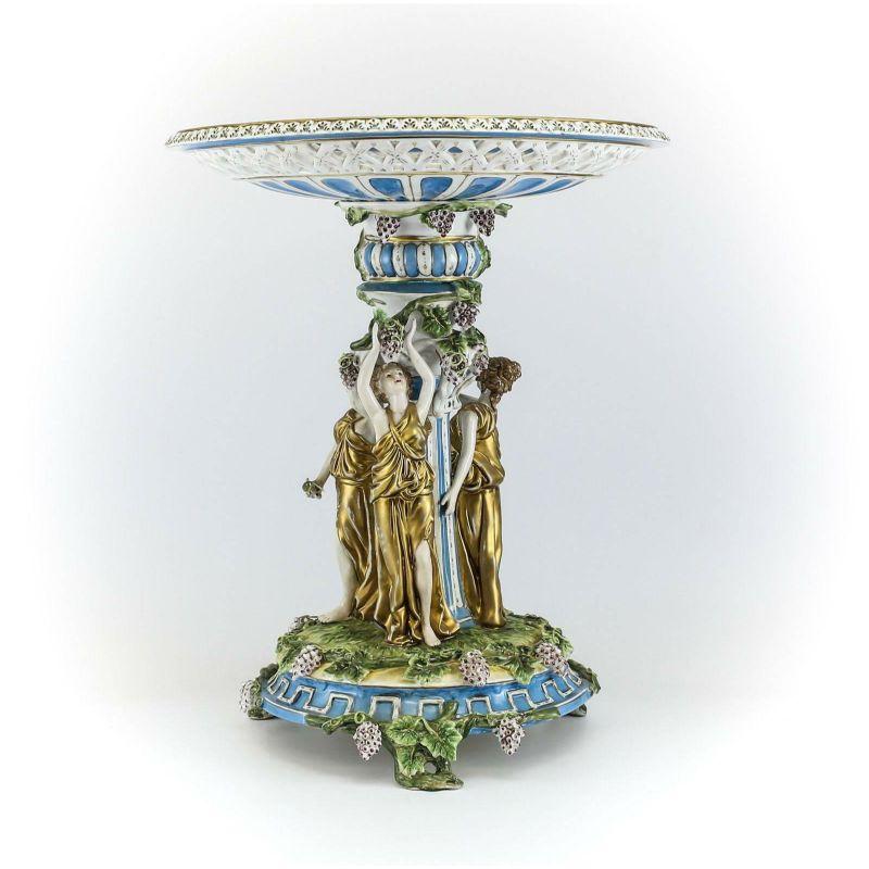 Pair of German large porcelain figural bacchantes tazza or stand, c1910

Pair of German large porcelain figural bacchantes circa 1910 with raised shallow pierced and floral bowls. Hand-painted gilt three deity figures with grape and leaf