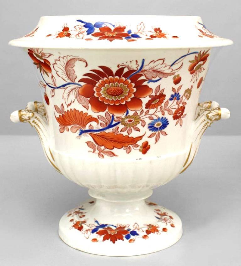 Pair of German Lowenstaff white porcelain with red and blue floral trim urns with handles (19th Cent) (Minor rePaired Chip) (PRICED AS Pair)
