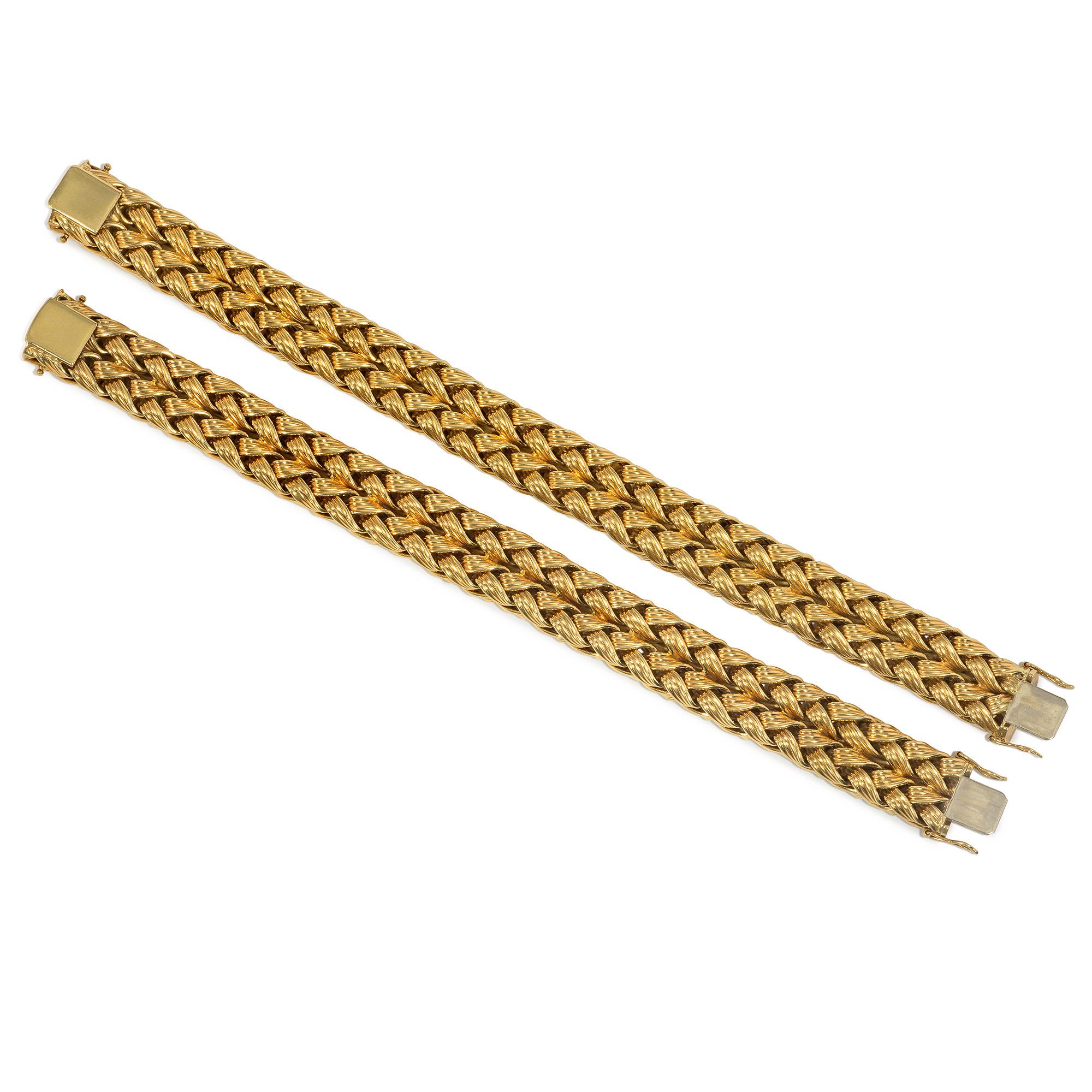 A pair of 1960s nested gold bracelets, each comprised of two rows of ribbed wheat chain, convertible to a collar necklace, in 18k.  Germany.

Respective lengths of bracelets: 7 5/8