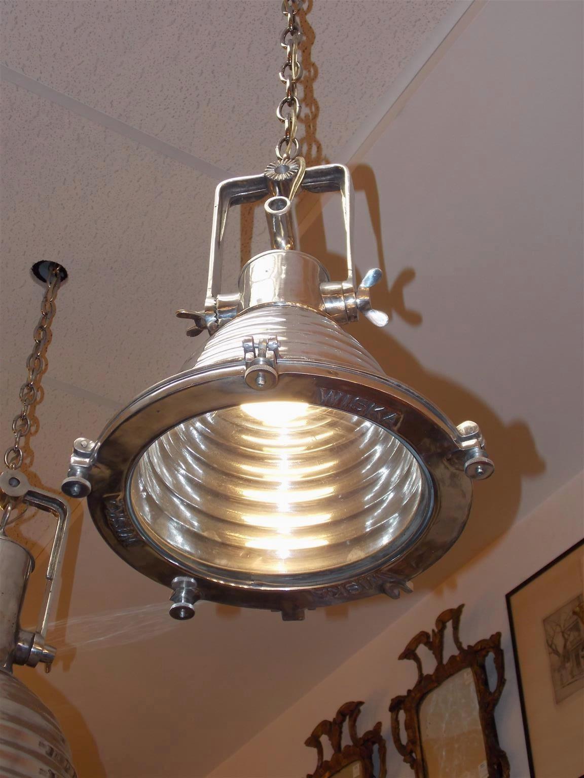 Pair of German Nautical aluminum hanging ship cargo lights with hinged yoke, rippled cowl, and original glass. Lights are marked Wiska on bezel and have been recently rewired, 20th century.
  
