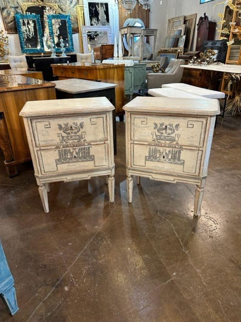 Decorative pair of German Neo-Classical style bedside tables. Very nice patina and 2 drawers for storage.  Pretty!!