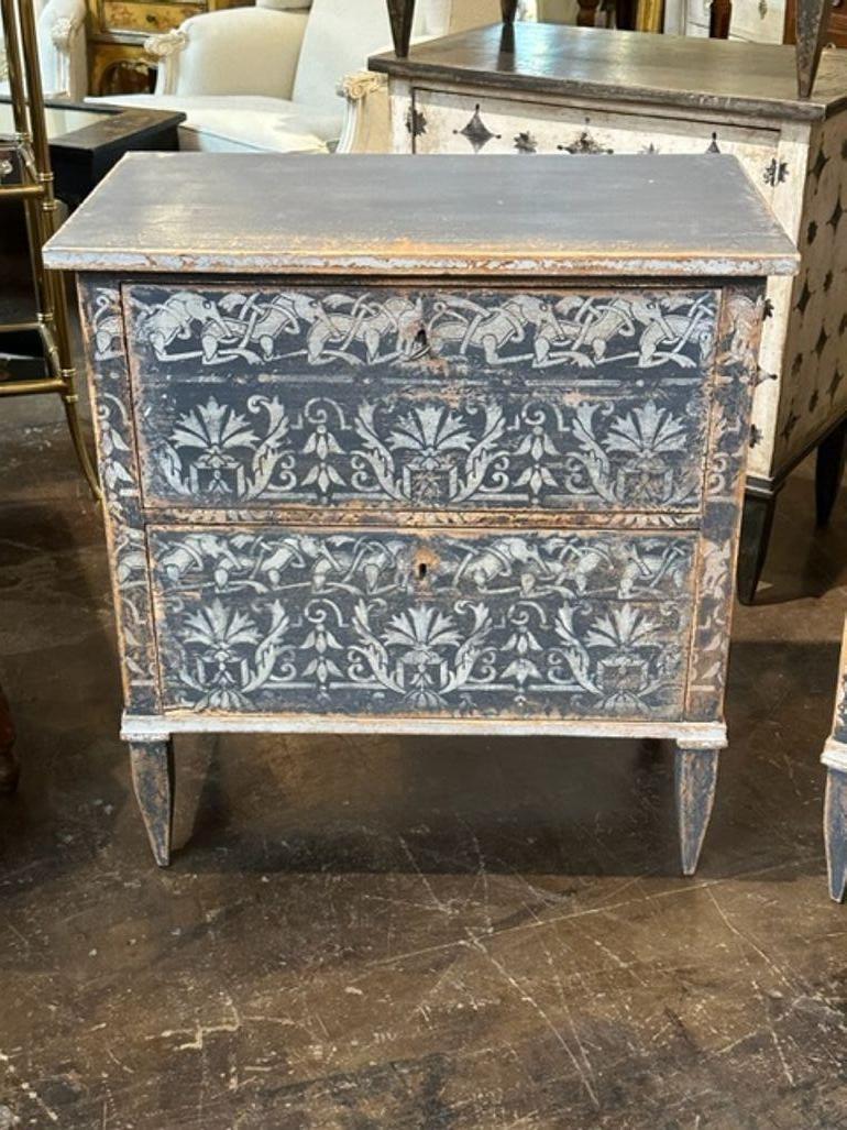 Nice pair of German Neo-Classical hand painted blue and white bedside tables. These are very unique and have a great patina!