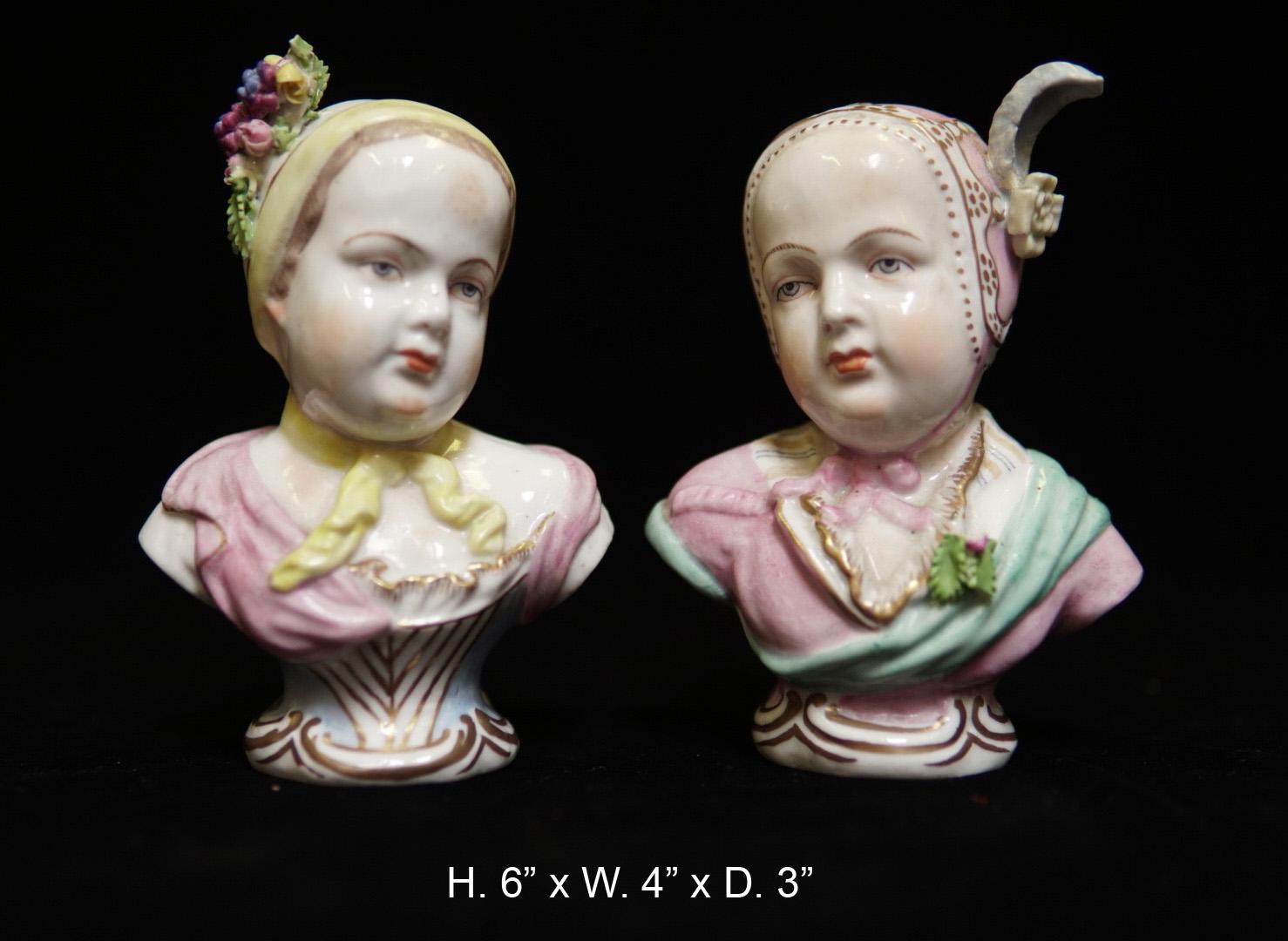 Pair of fine quality German glazed and hand painted porcelain bust of babies bearing an underglazed blue mark in the back,
First half of the 20th century.

Each bust wearing a floral and fruit decorated hat. Meticulous attention was given to the