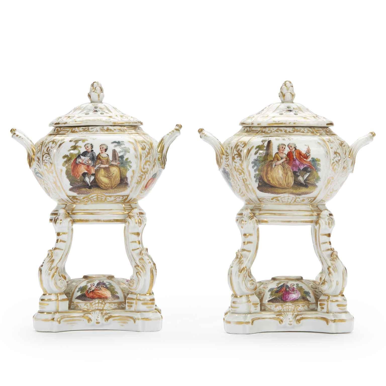 An exquisite pair of early 19th century Berlin KPM porcelain pastille, incense burners, two antique oval perfume containers with pierced lids, pine cone finials above oval burner. Painted with naturalistic flowers. Blue sceptre mark, impressed