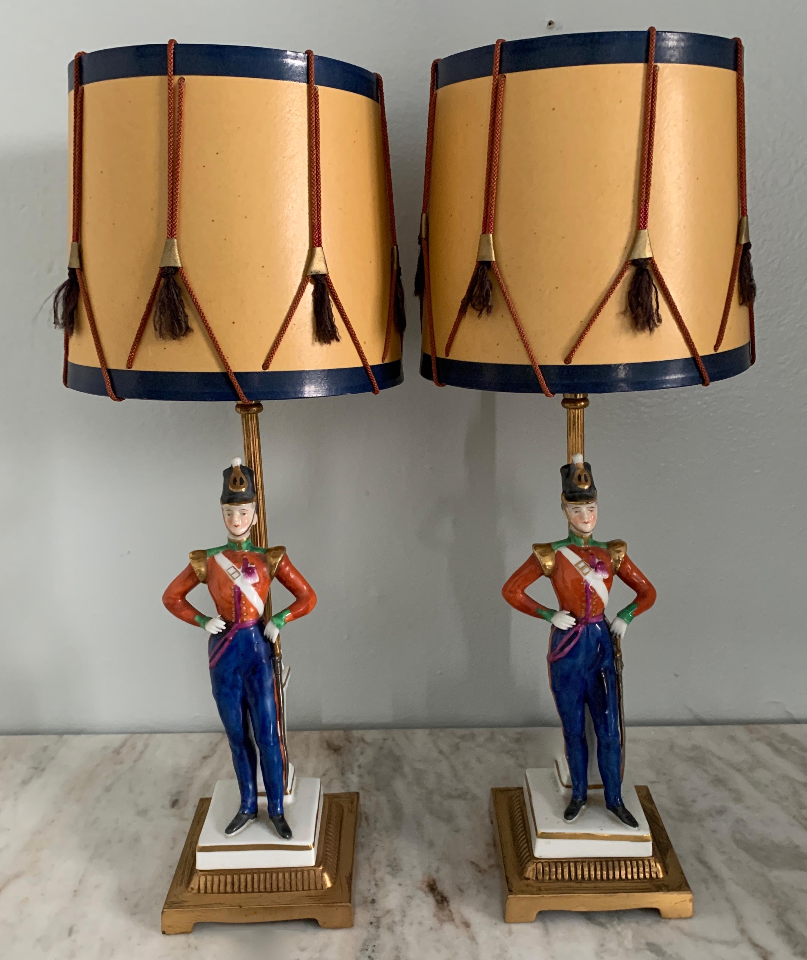 Gilt Pair of German Porcelain Soldier Lamps on Bronze Mounts with Drummer Shades