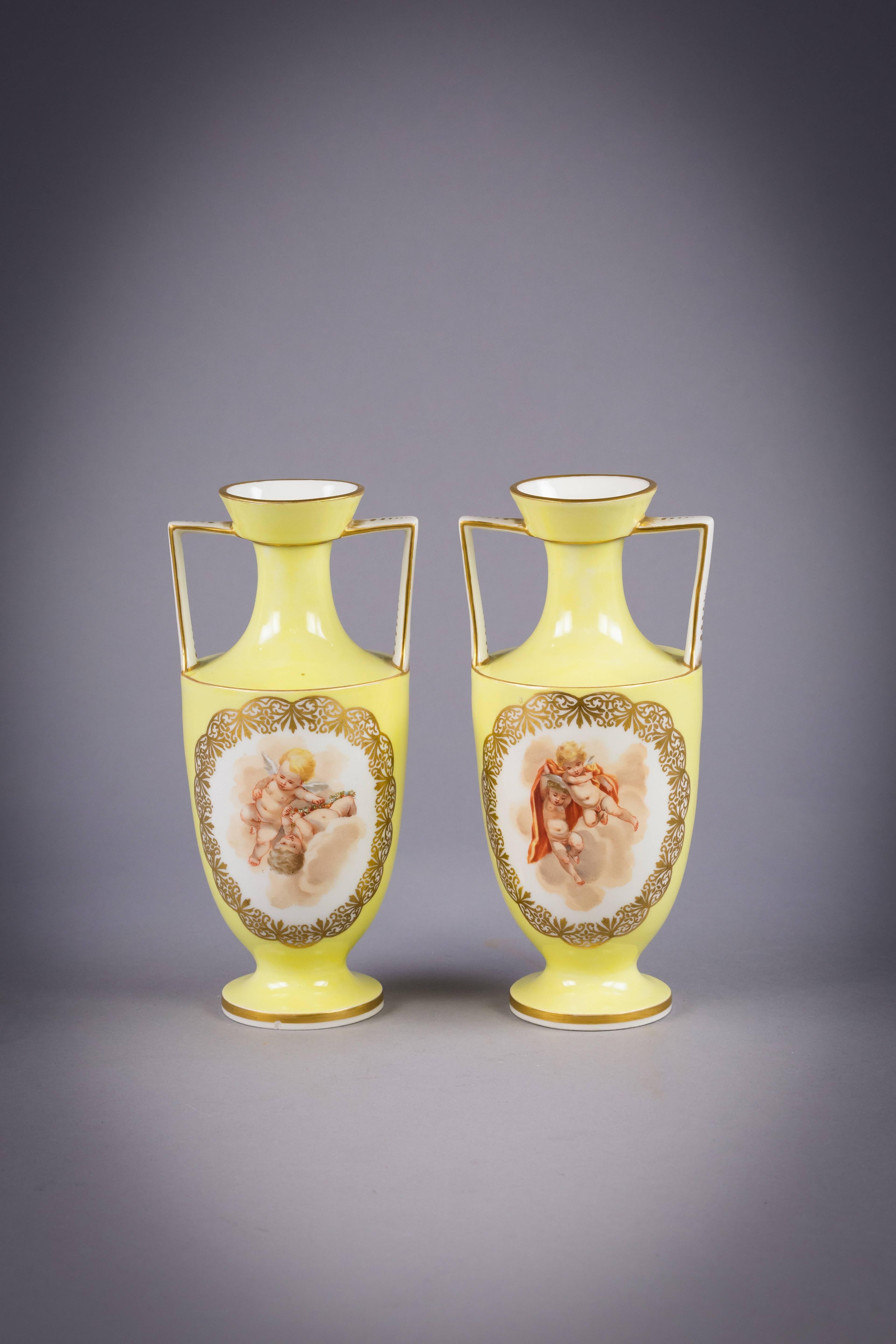 Pair of German porcelain yellow ground two handled vases, Berlin, circa 1900.