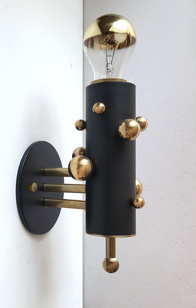 Pair of beautiful solid brass bubble and iron tube wall lights by miiss studio.
Germany
Lamp sockets: One E27 (US E26).