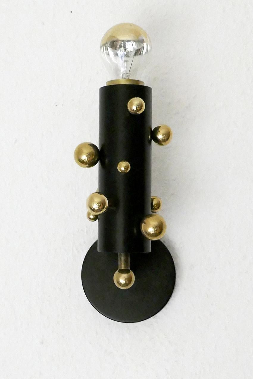 Pair of beautiful solid brass bubble and iron tube wall lights by miiss studio.
Germany
Lamp sockets: One E27 (US E26).