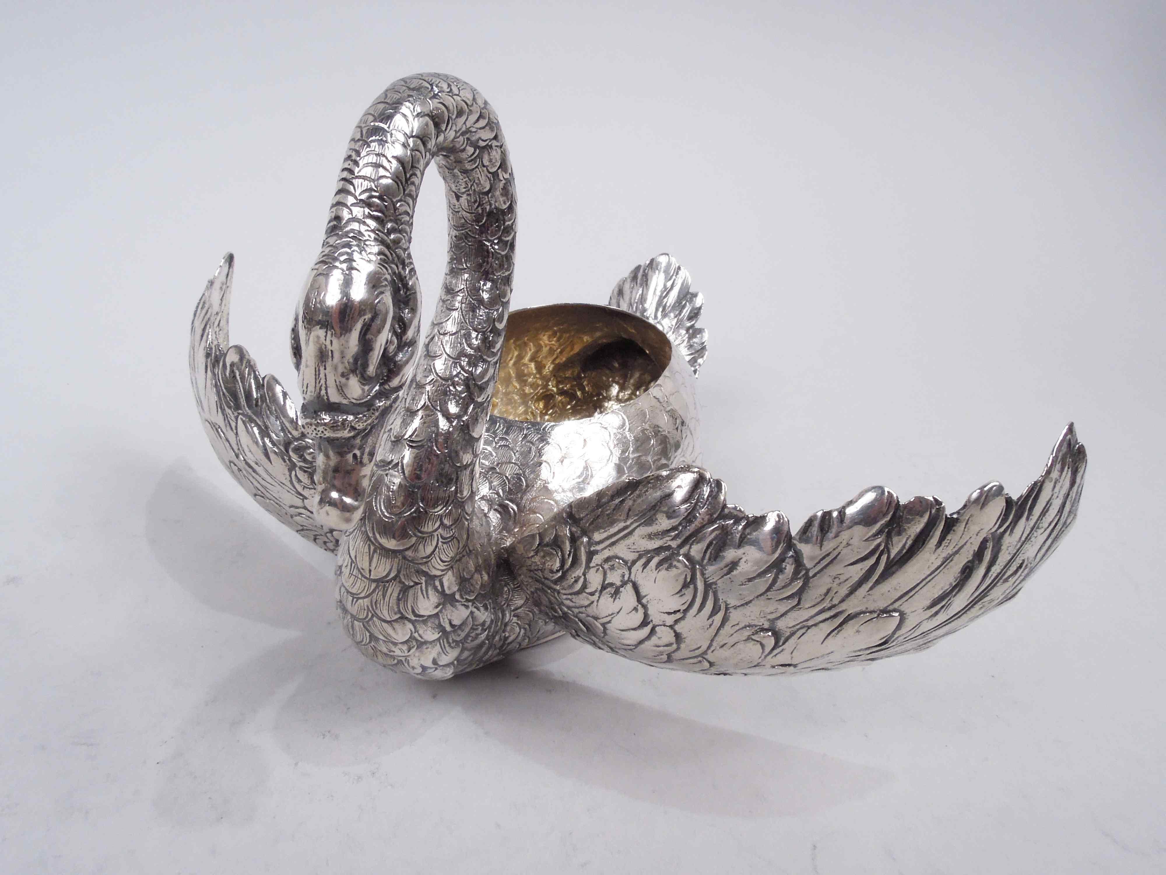 Pair of German 800 silver figural bird bowl, ca 1920. Each: Swan with ovoid body, upturned tail, and scaly-s-scroll neck terminating in in closed bill. Imbricated feathers and hinged plumy wings that can be opened to suggest flight. Hollow