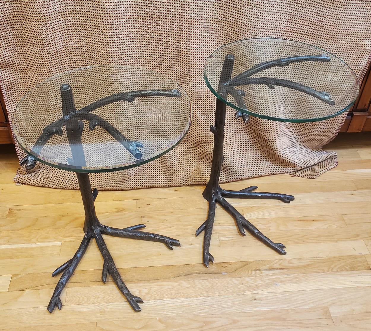 A Pair of “Giacometti” inspired Metal End Tables. Good proportions with bases sculpted in the form of tree branches and roots. Each retaining the original beveled glass tops. 
Measures: 24” H 16” Dm.
 