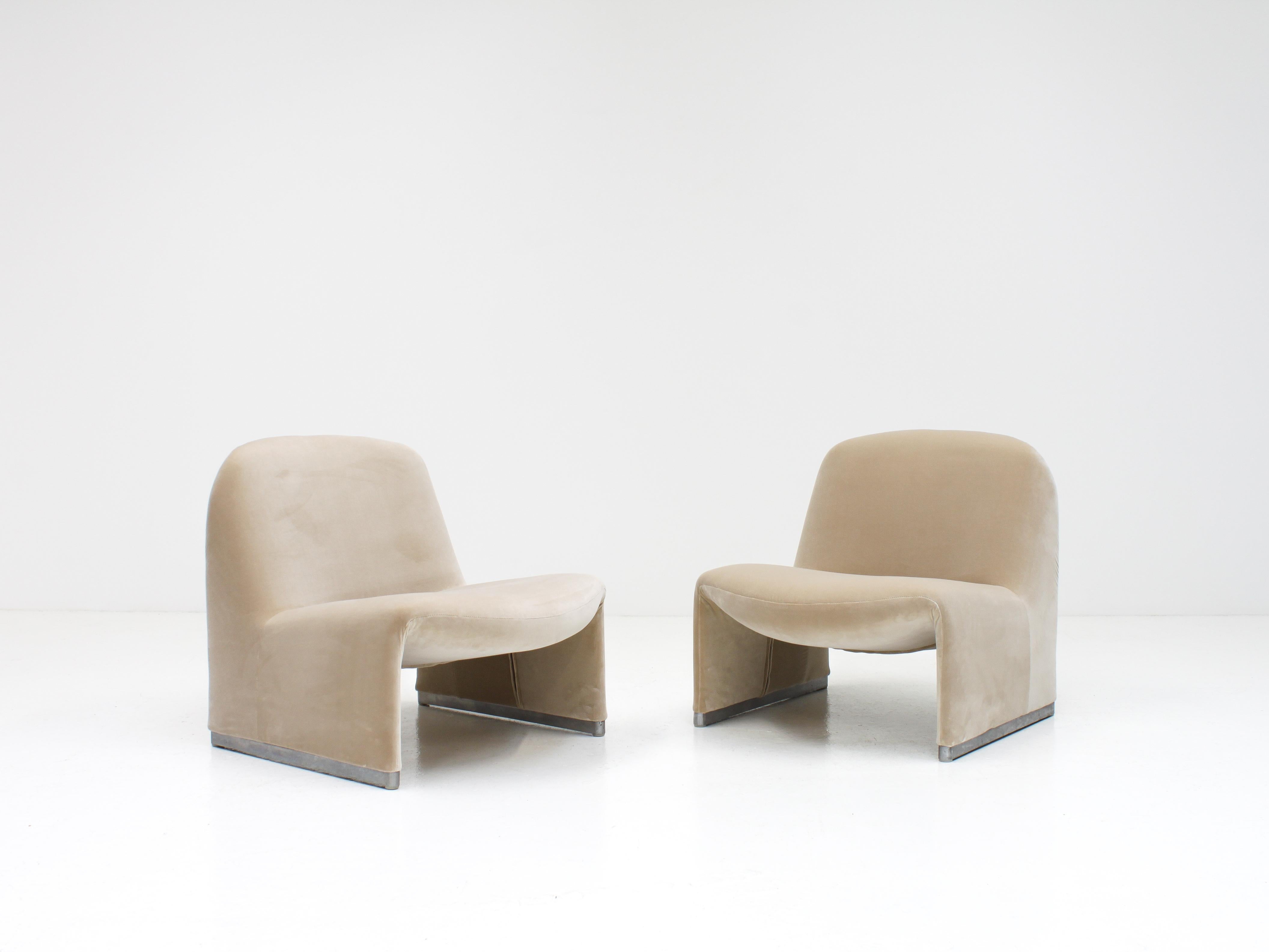 A pair of Giancarlo Piretti “Alky” chairs newly upholstered in Designers Guild linen-colored cotton velvet.

Designers Guild 'Varese' velvet, is a cotton velvet that is lustrous and elegant.

The Alky chairs themselves were manufactured by Artifort