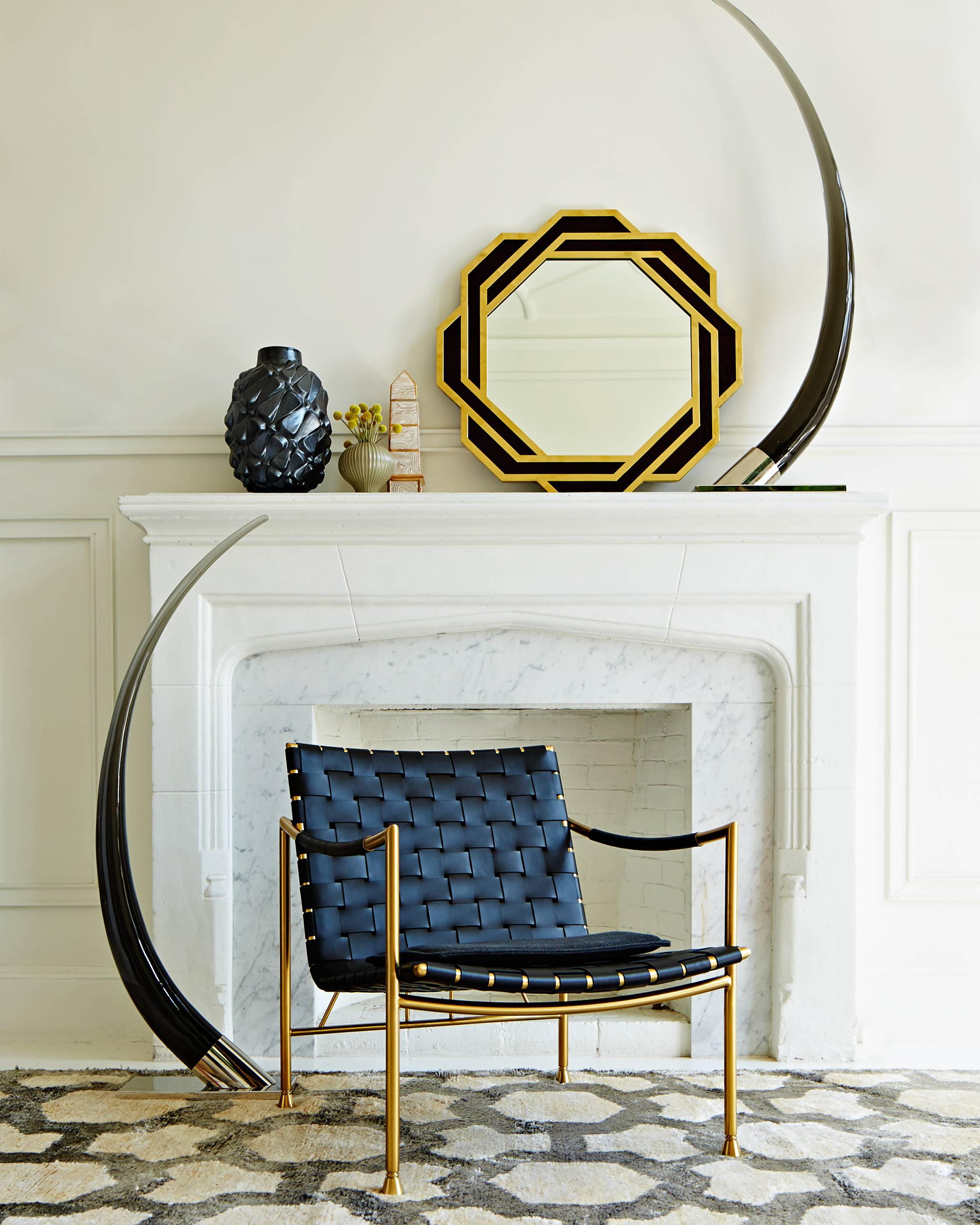 Haute horn. We've reinterpreted the decorating Classic the ornamental tusk—in moody smoked Lucite, set on a polished steel mount. At 49 inches high, they look fab flanking a fireplace or adorning a credenza. Unleash your inner connoisseur with this