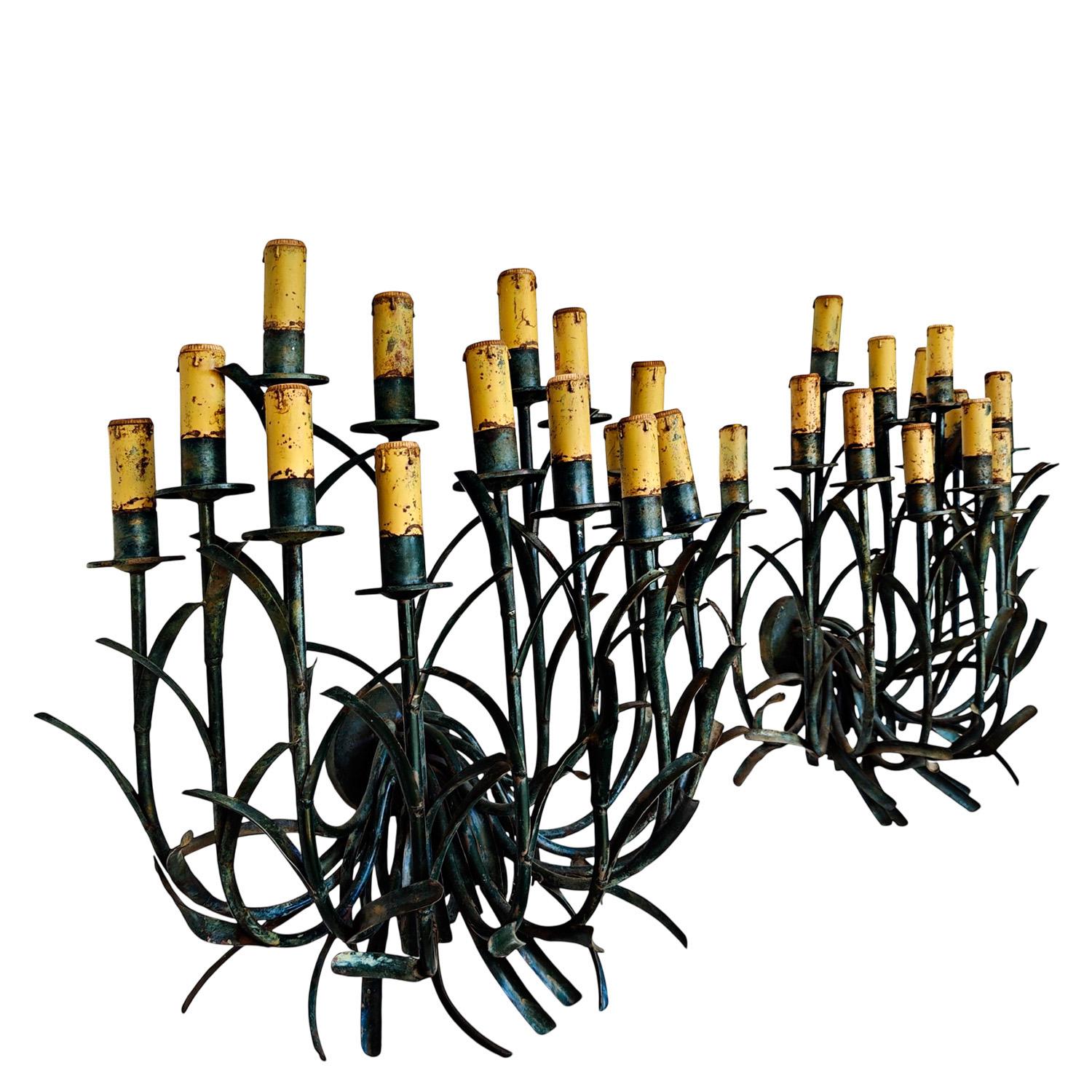Pair of giant wall lights with 14 arms in green patinated iron and candle lamp holders in cream patinated iron.

Brand label: “Trineo”

Spain circa 1960-70