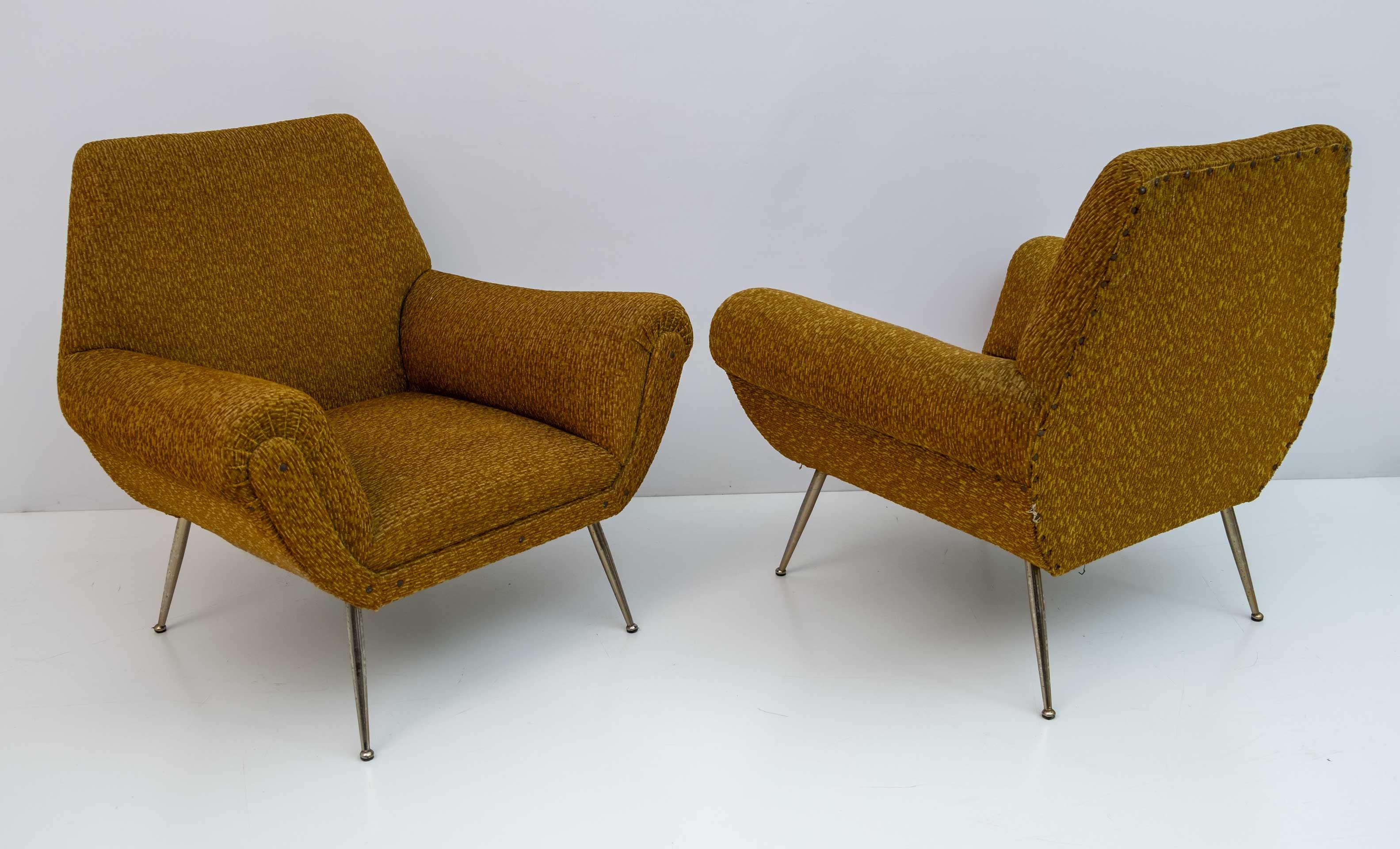 Pair of armchairs designed by Gigi Radice for Minotti. They are made with solid wood structure, fabric upholstery with golden metal legs. The armchairs need a new upholstery.