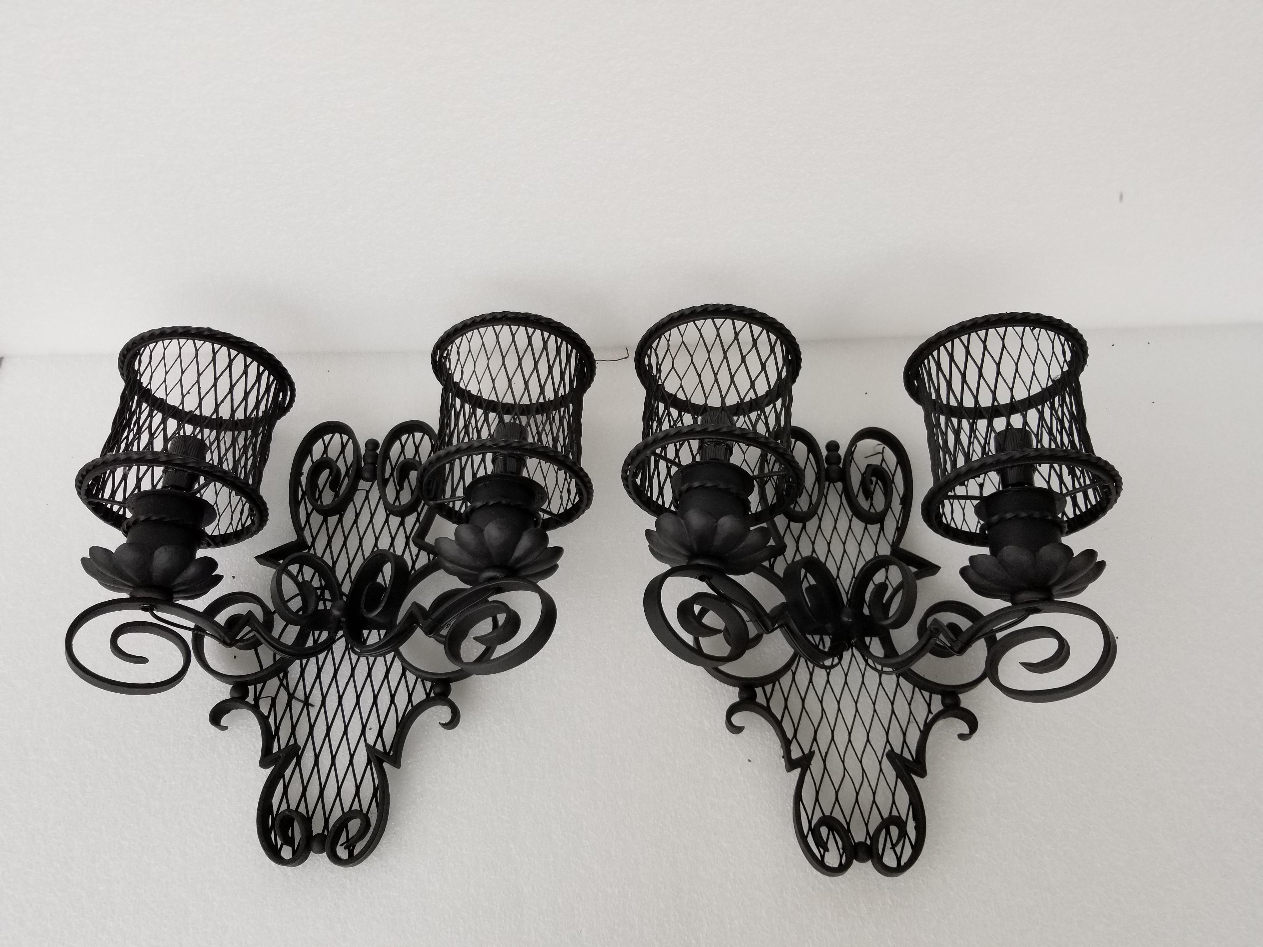 Pair of Gilbert Poillerat Style Sconces In Good Condition In Miami, FL