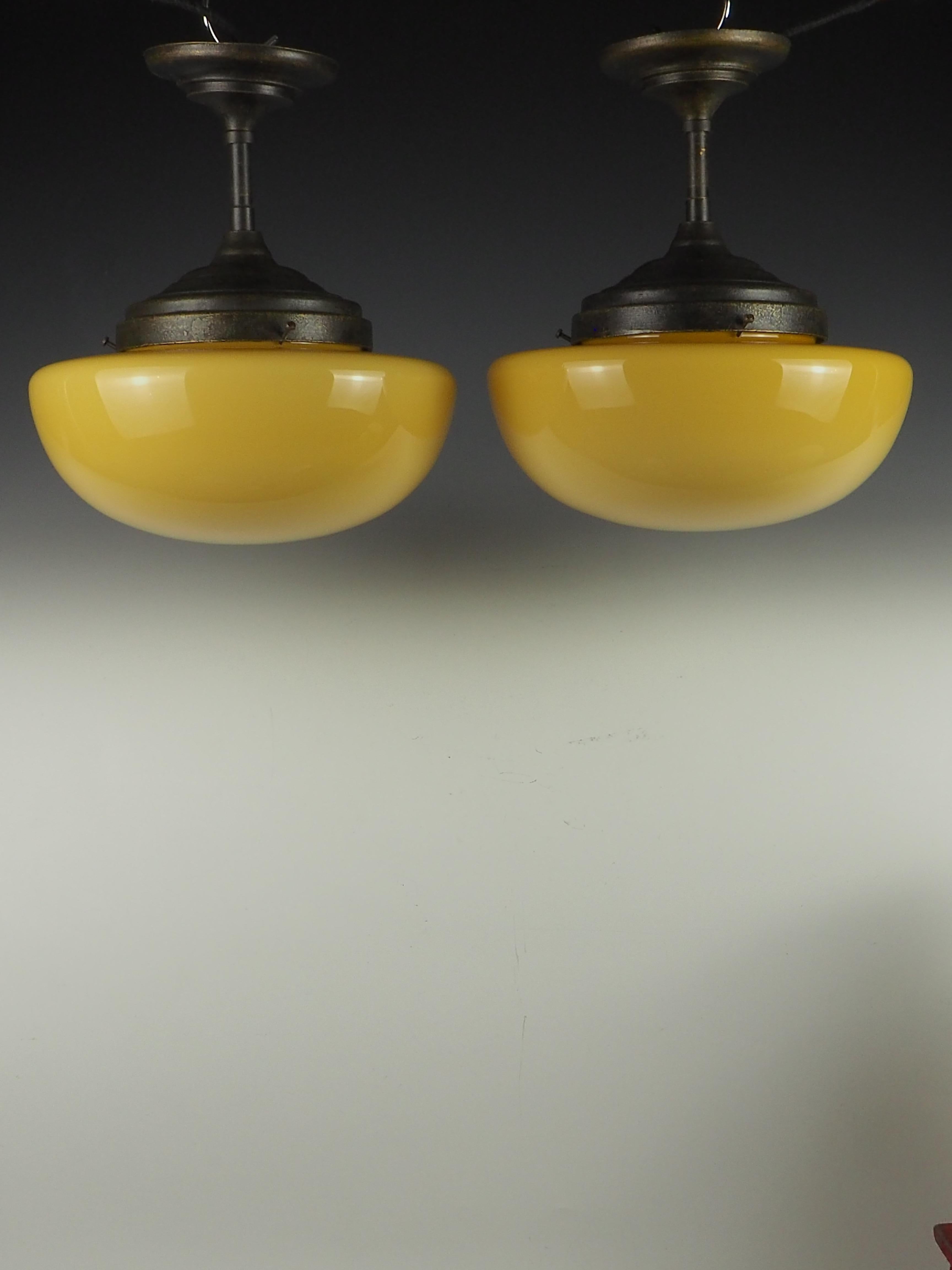 Elevate your interior decor with this exquisite pair of Gilde Handwerk Ceiling Opaline Pendants, a stunning representation of Mid Century Modern design crafted in West Germany circa 1960.

These pendants feature elegant opaline shades that diffuse