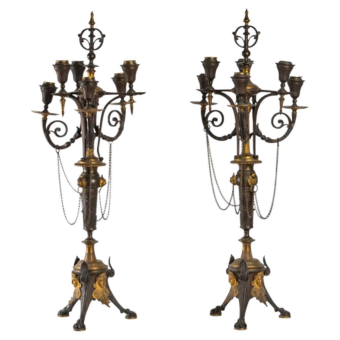 Pair of gilded and patinated candlesticks.
Late 19th - early 20th century.
Measures: Height : 74 cm
Width: 29 cm.