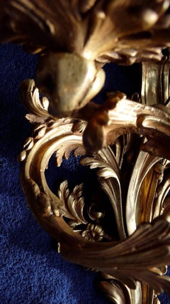 Paire d'appliques Louis XV à trois lumières en bronze doré