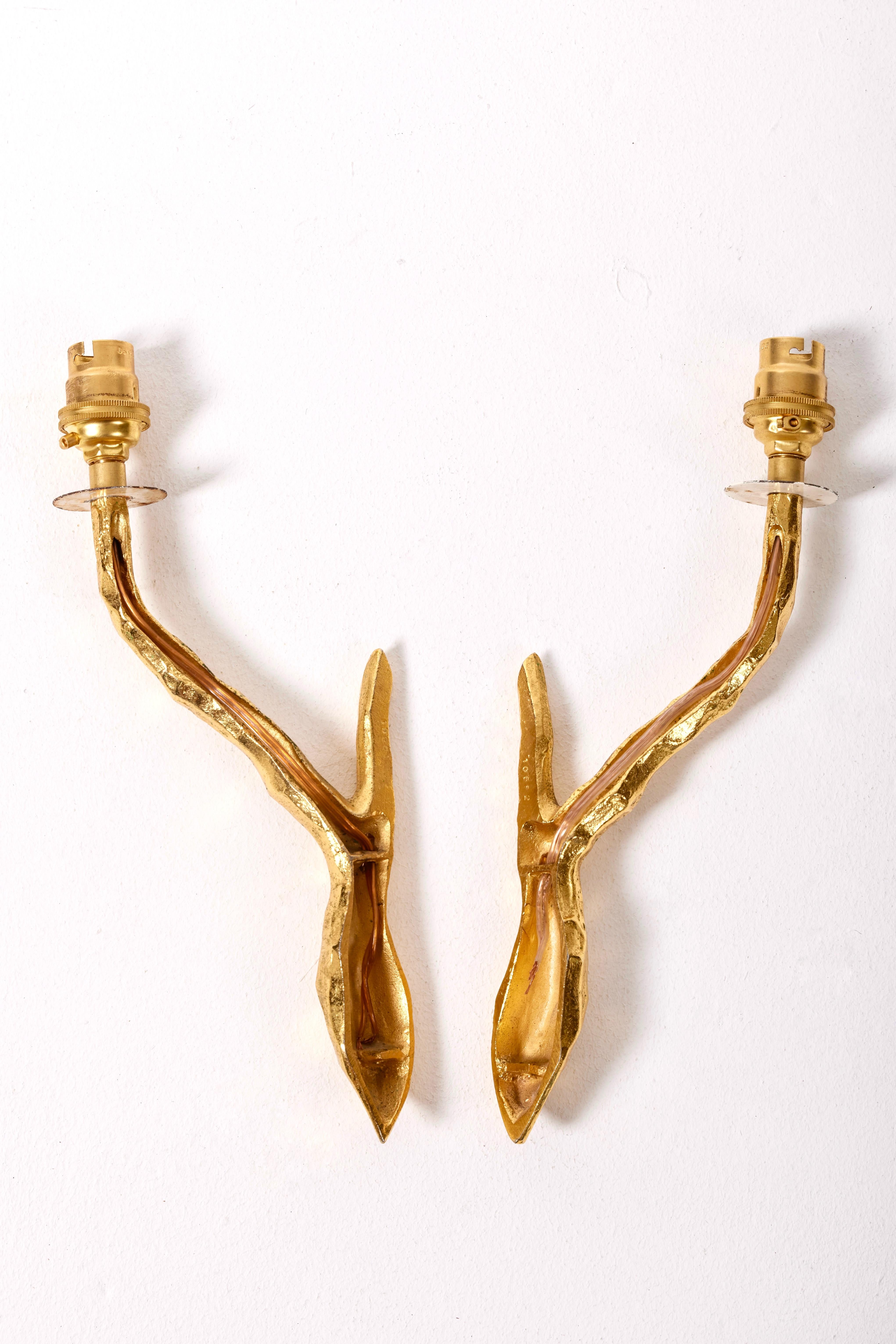 Pair of gilded bronze wall sconces by Maison Arlus For Sale 1