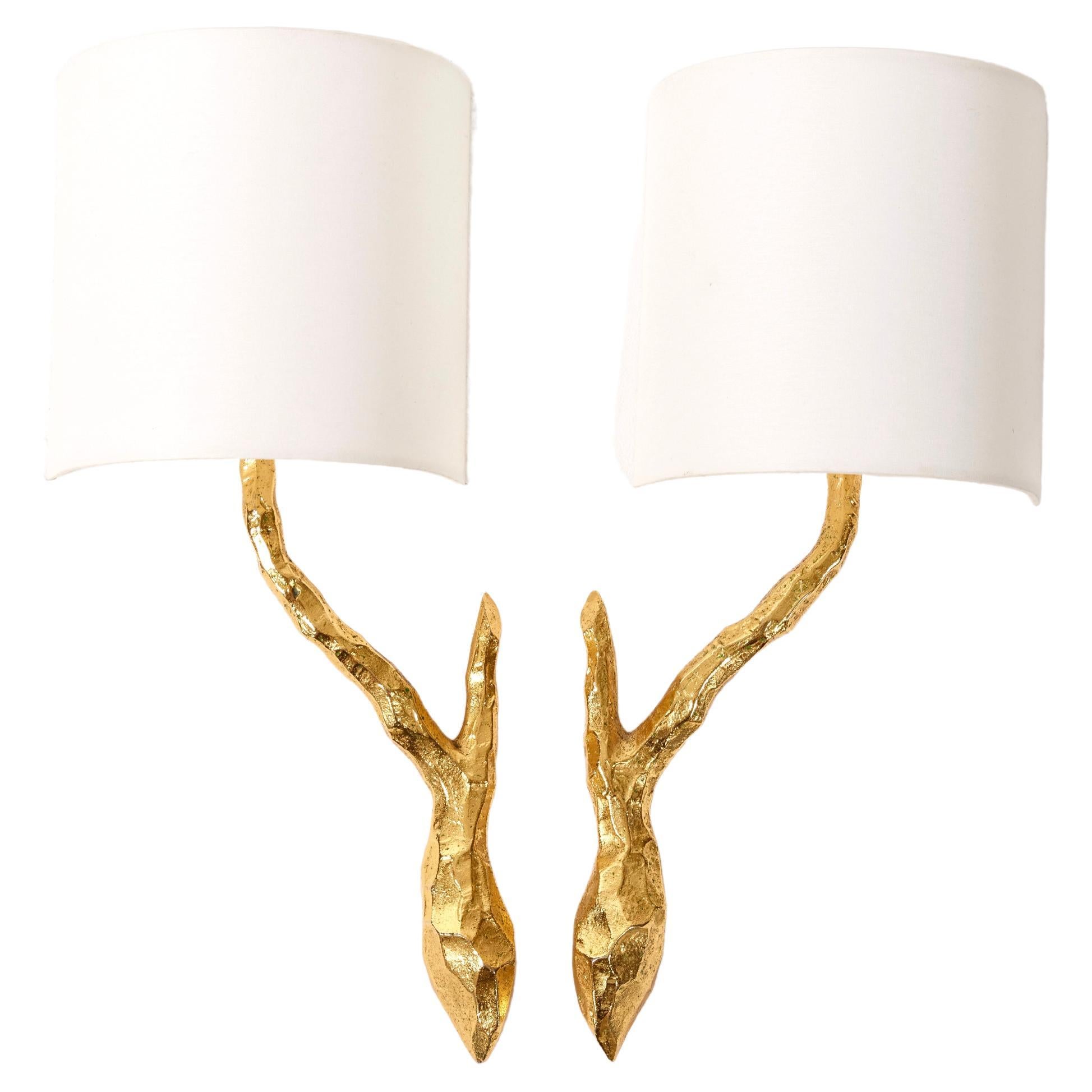 Pair of gilded bronze wall sconces by Maison Arlus For Sale