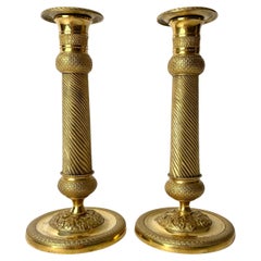 Antique Pair of Gilded French Empire Candlesticks with charming decor from the 1820s