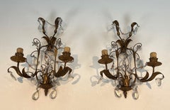 Pair of Gilded Metal and Crystals Wall Sconces in the style of Maison Baguès