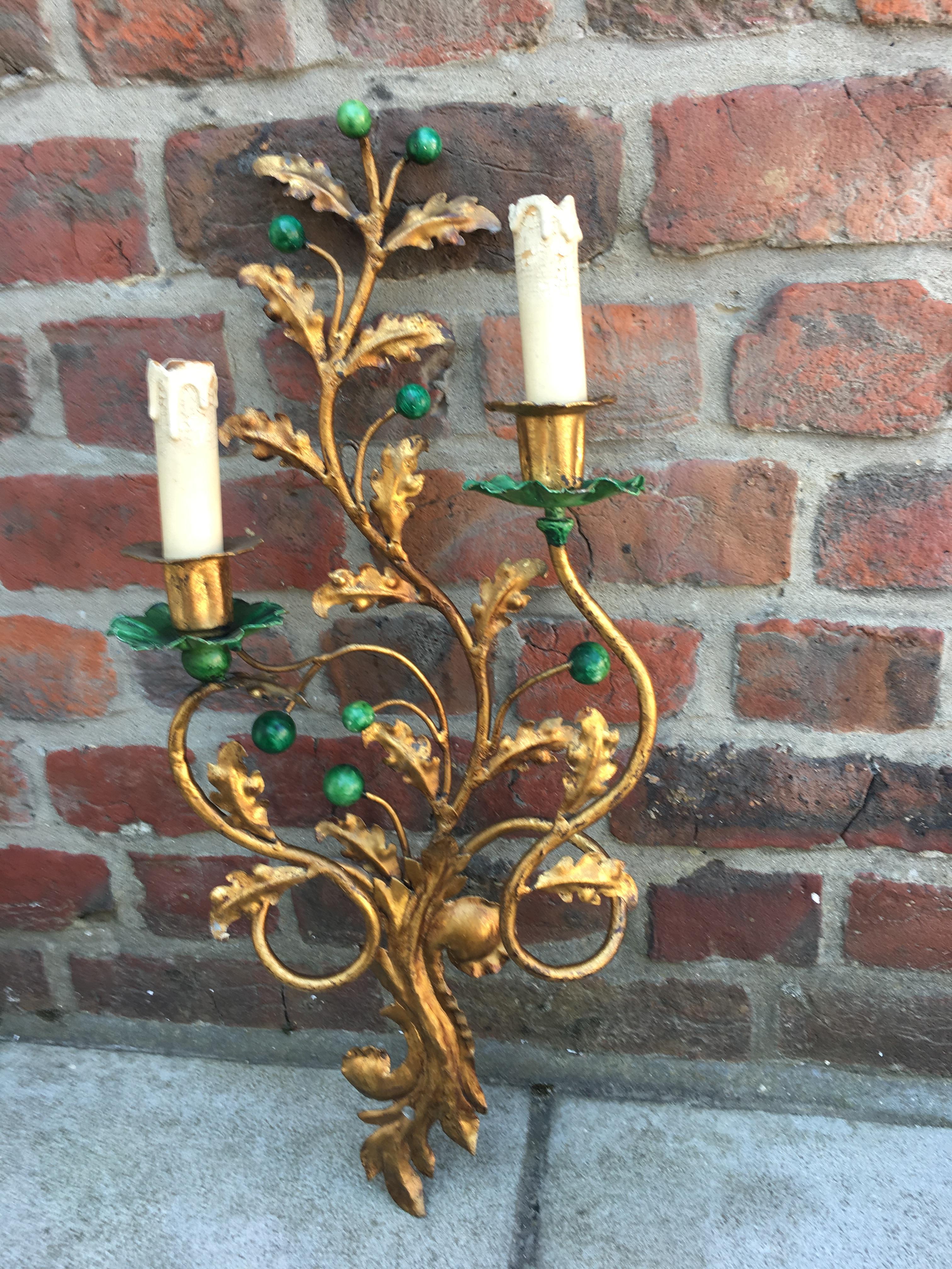 Pair of gilded metal and lacquered green appliques, 