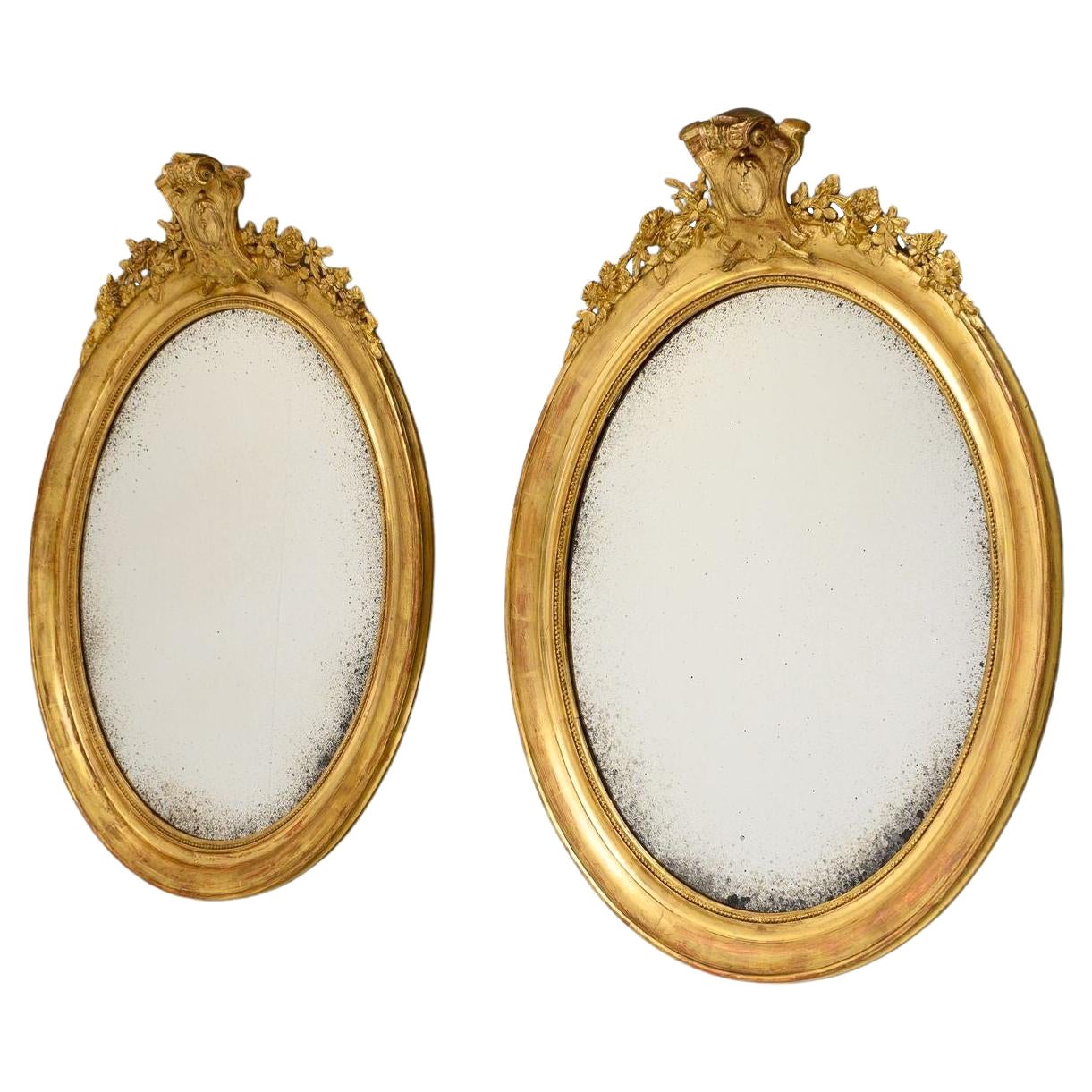 Pair of Gilded Oval Mirrors