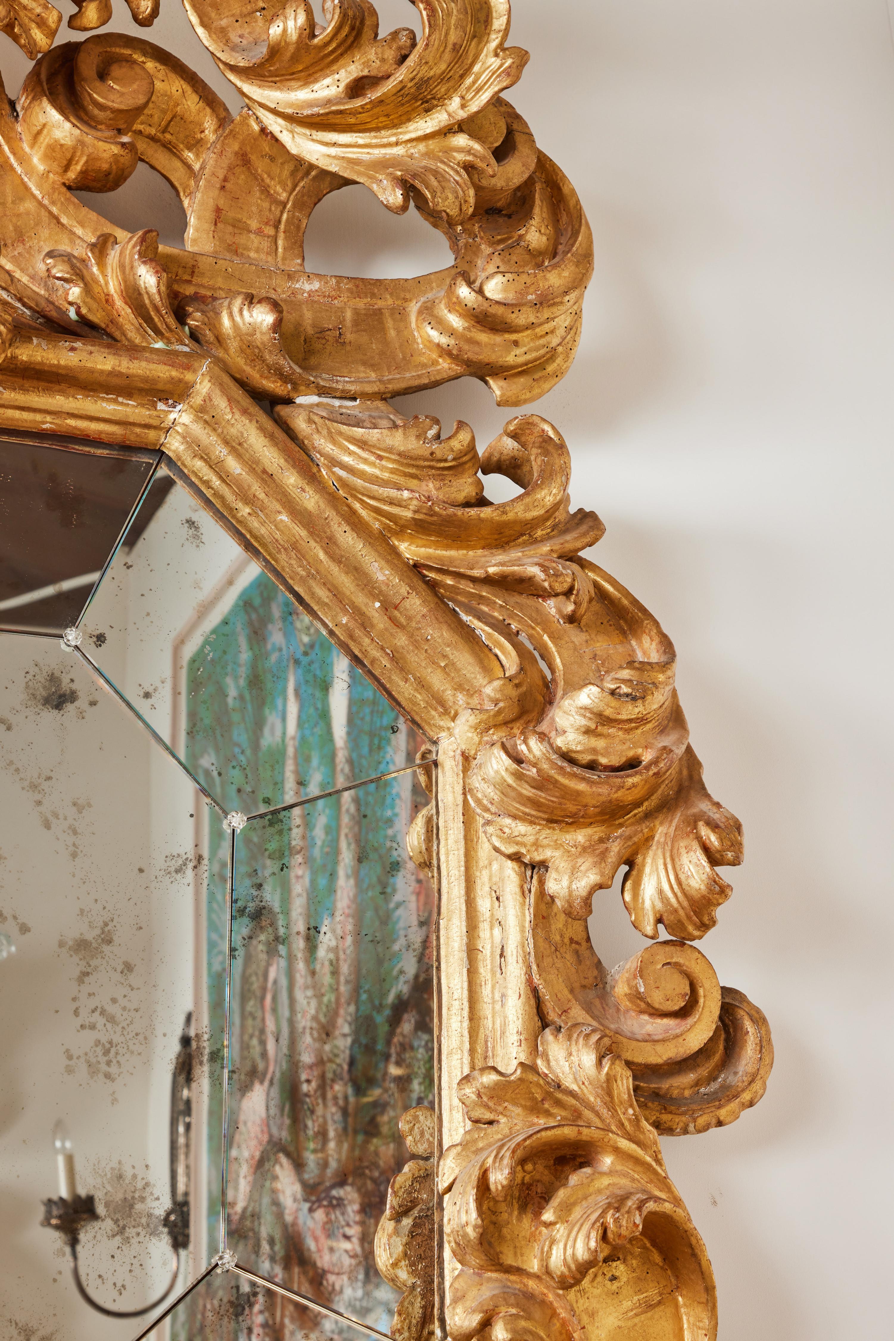 Hand-Carved Pair of Gilded Roman Mirrors For Sale
