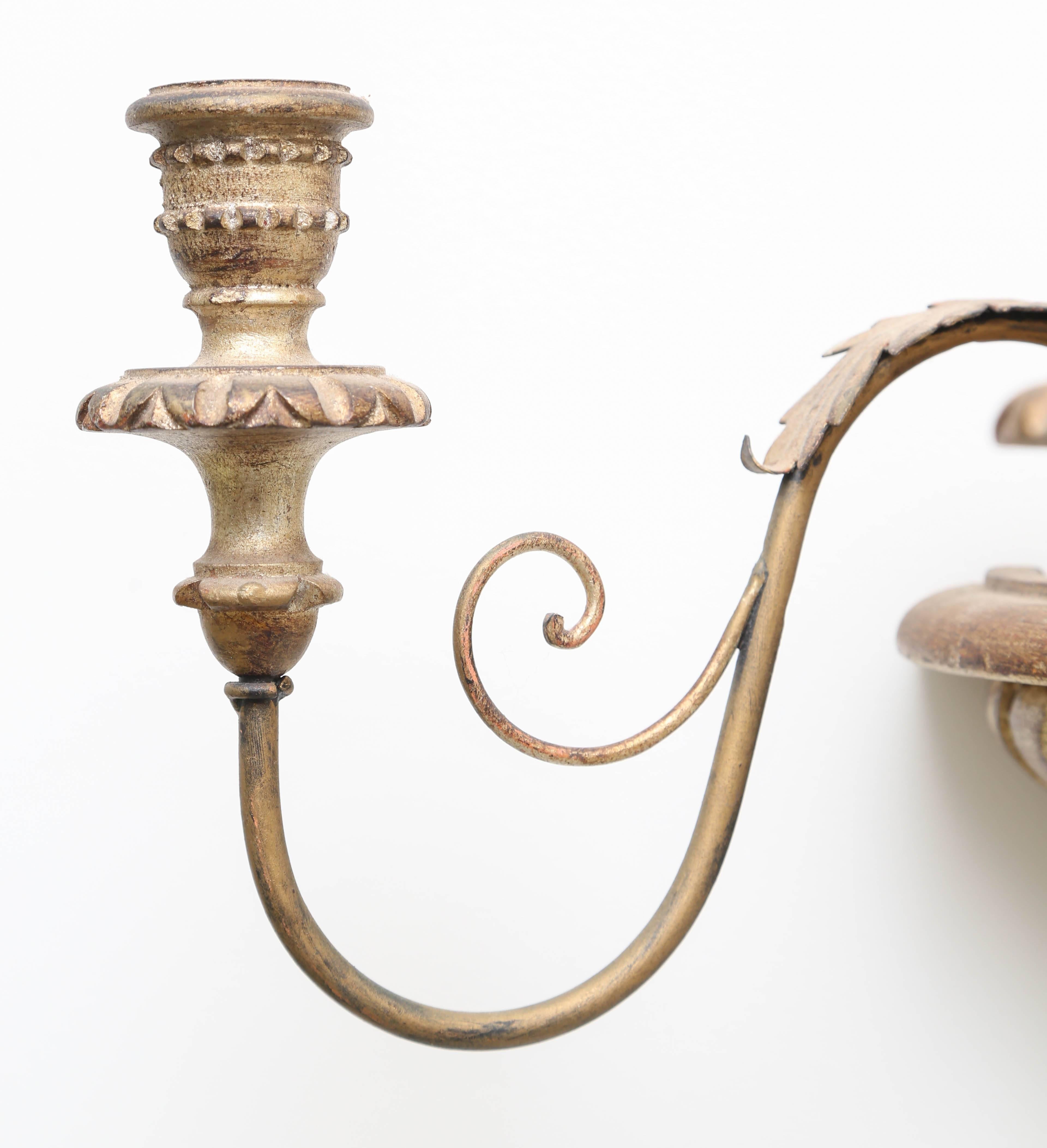 Large pair of carved wood and gilt sconces currently used with candles.