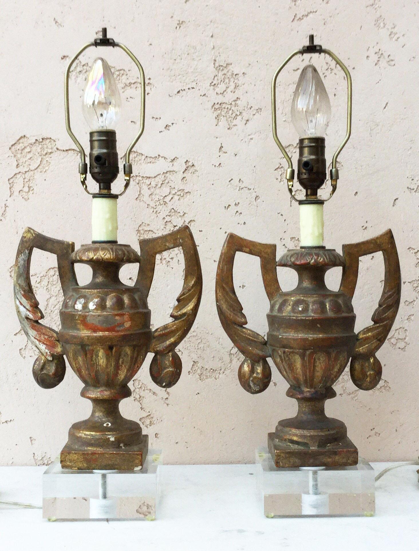 Antique gilded wood vase lamps urn shaped circa 1890 mounted on Lucite bases, rewired for US and working. 
New shades, 12