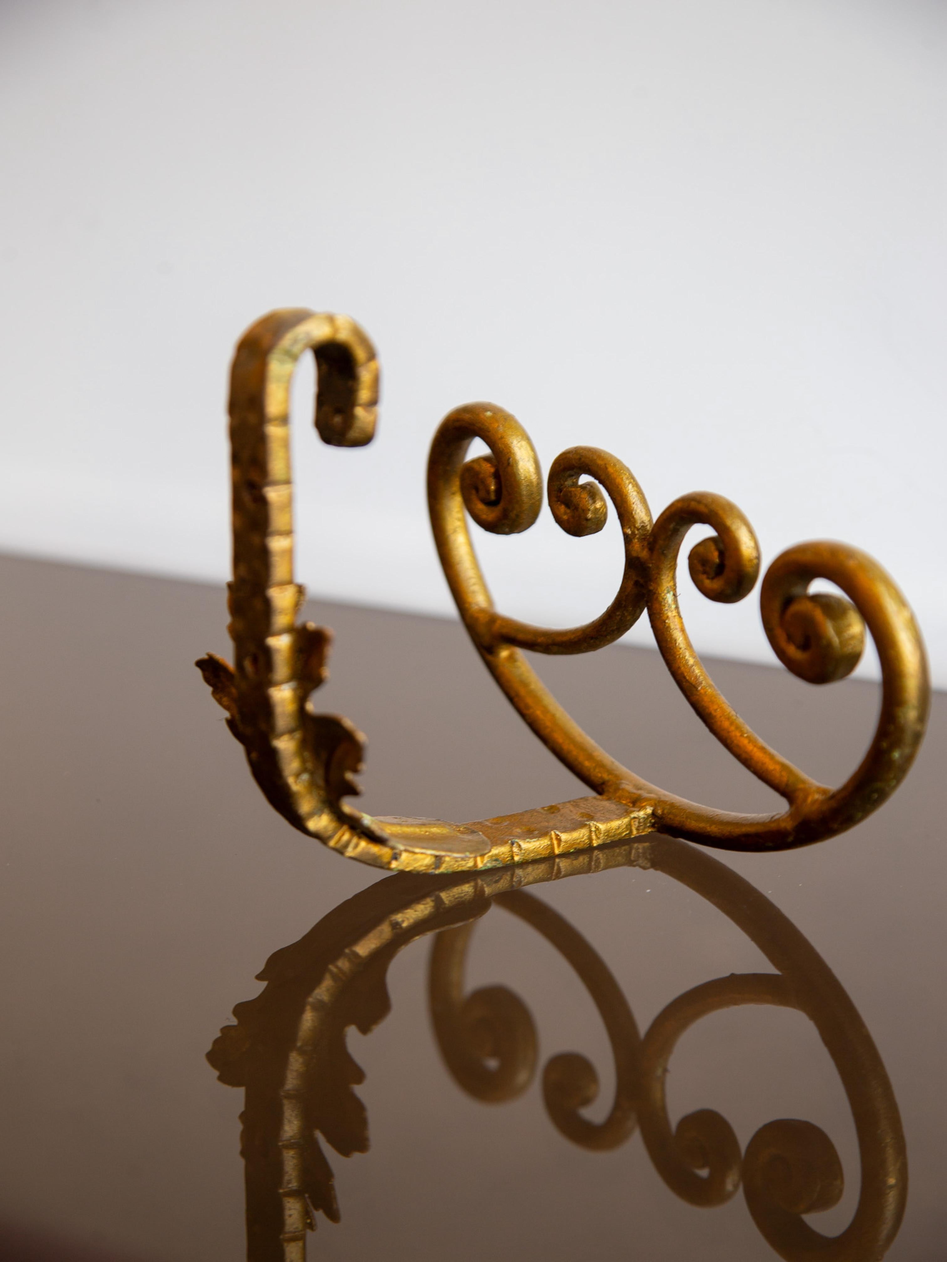 Italian Pair of Gilded Wrought Iron Wall Hooks For Sale