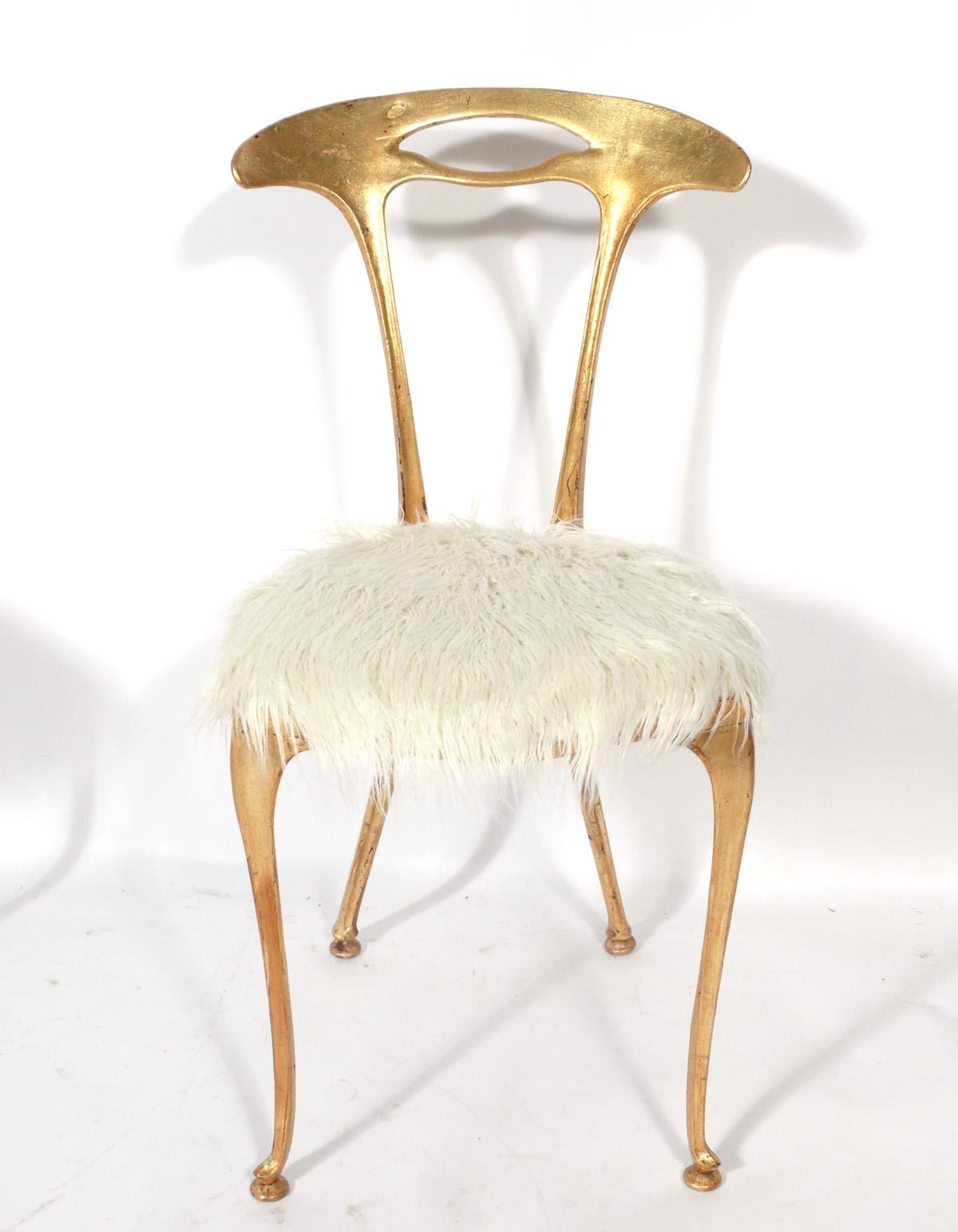 Pair of surrealist gilt metal and faux lamb upholstered chairs, designed for Palladio, Italy, circa 1950s. The price noted in this listing is for the pair of chairs.