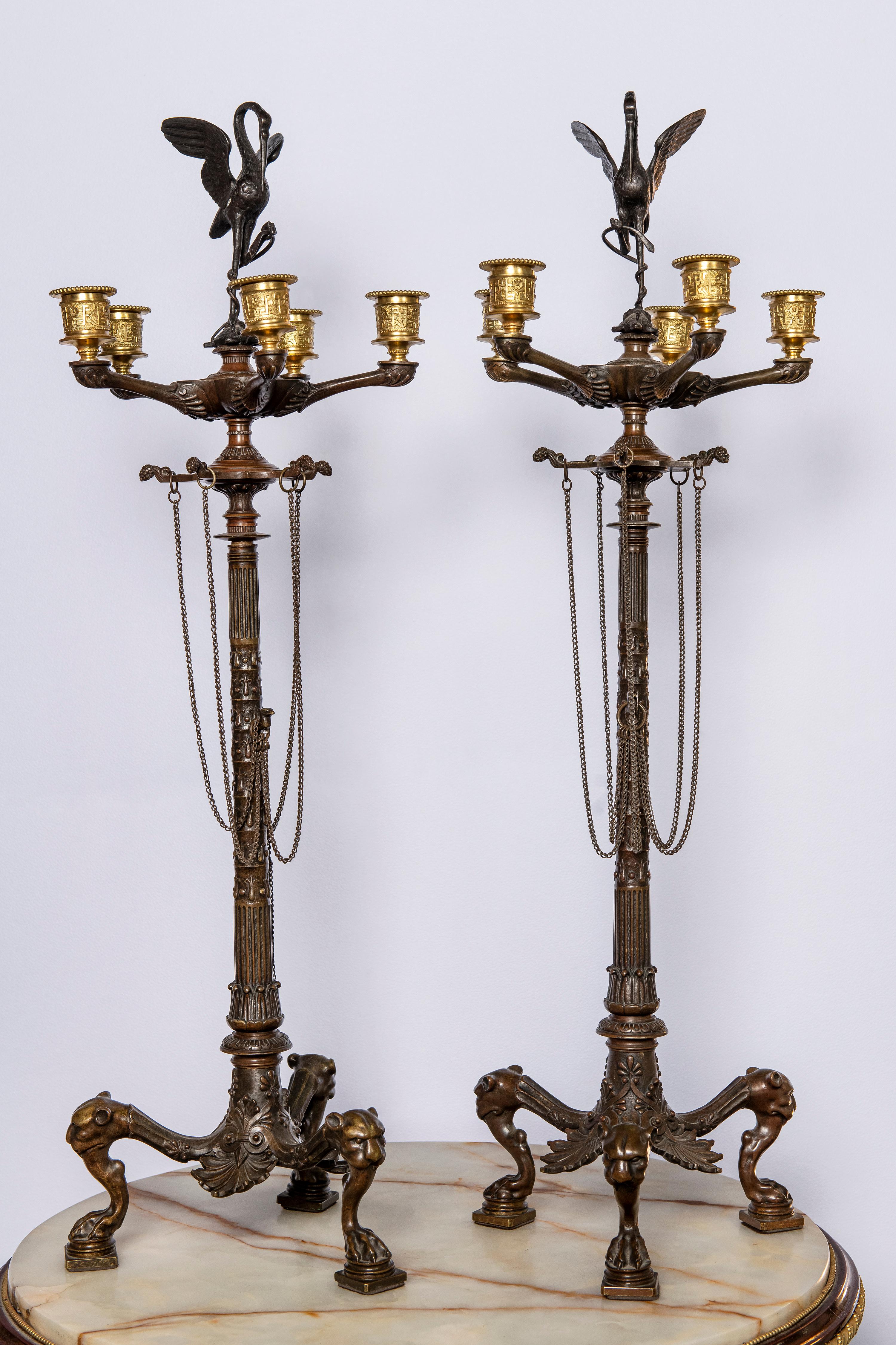 Pair of gilt and patinated bronze candelabra. France, 19th century.