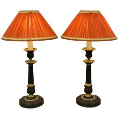 Antique Pair of Gilt and Patinated Bronze Candlestick Lamps with Orange Silk Shades