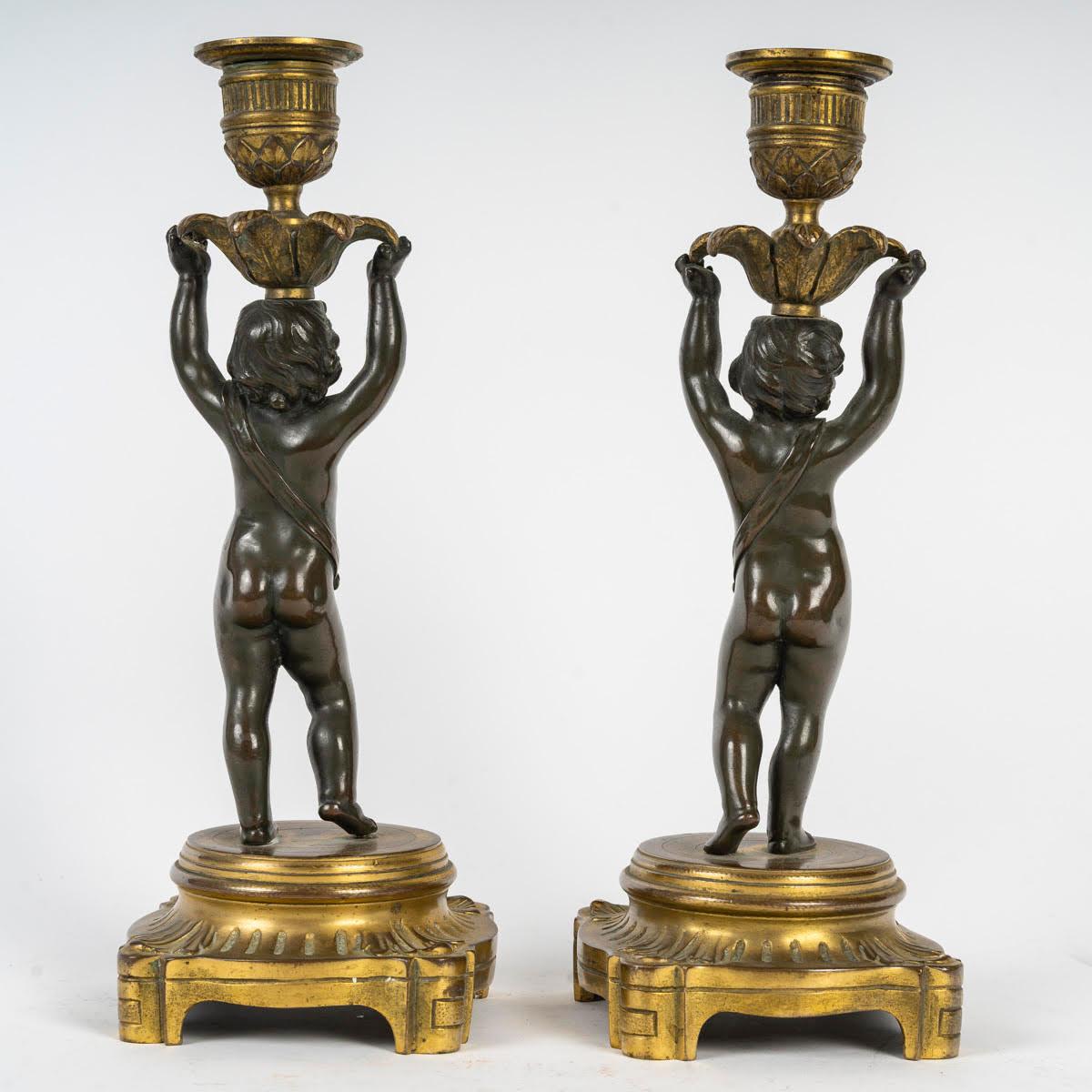 Pair of Gilt and Patinated Bronze Candlesticks, 19th Century, Louis XVI Style. In Good Condition For Sale In Saint-Ouen, FR
