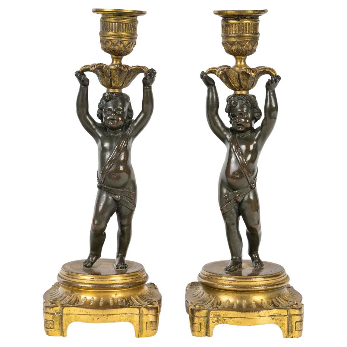 Pareja de Candeleros de Bronce Dorado y Patinado, Siglo XIX, Estilo Luis XVI.
