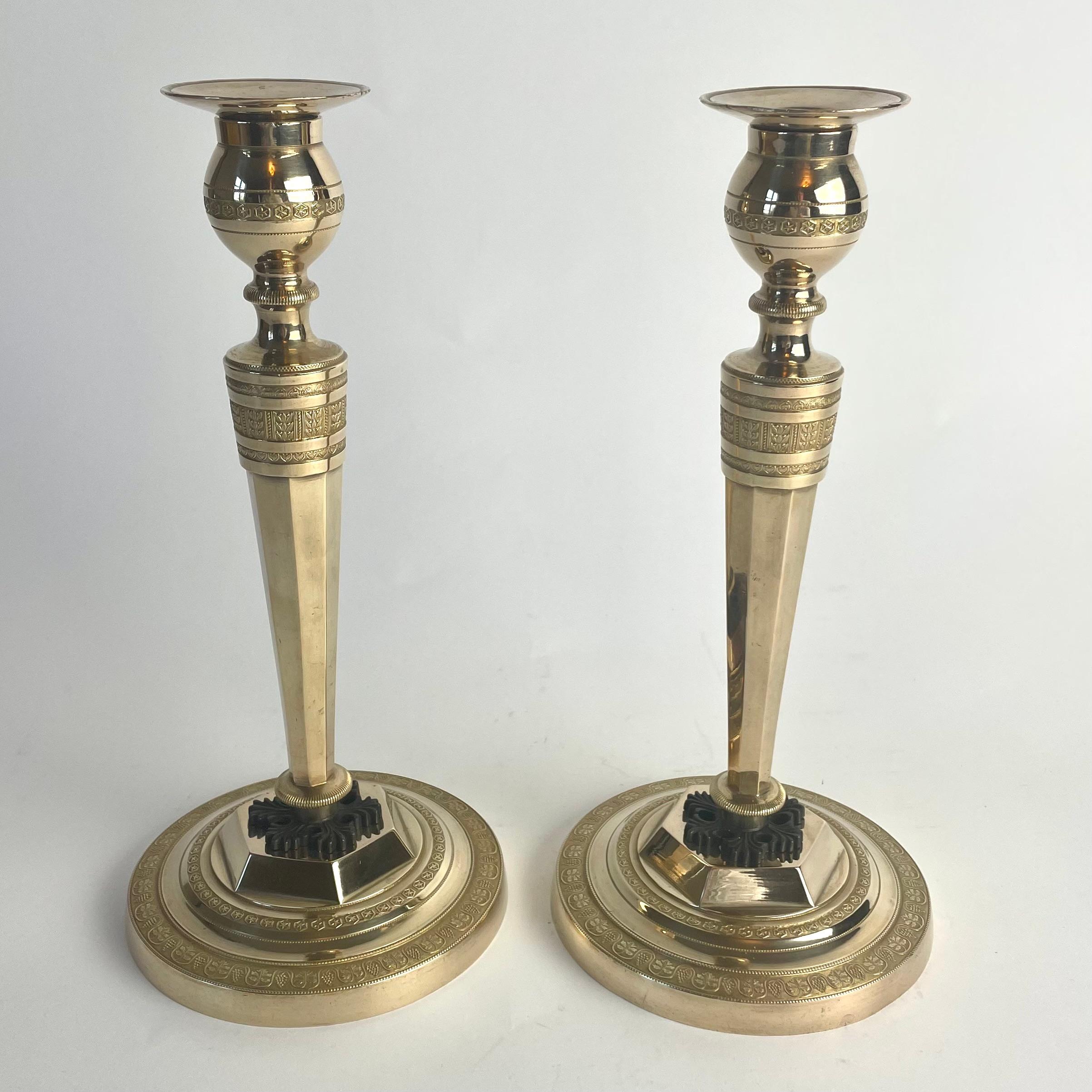 French Pair of Gilt and Patinated Bronze Candlesticks. Directoire, Late 18th Century For Sale