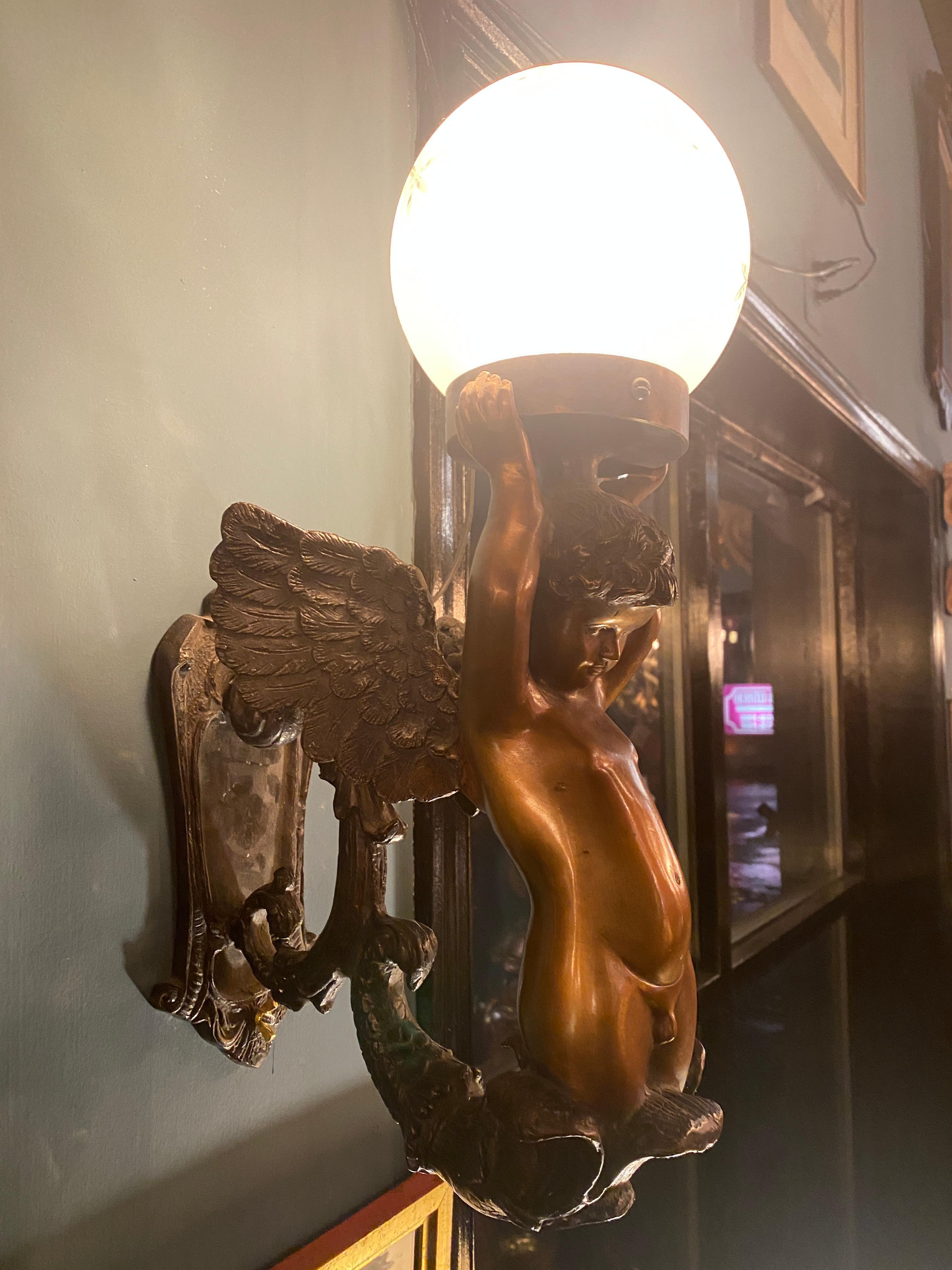 Pair of Gilt and Patinated Bronze Cherub Wall Sconces In Good Condition For Sale In Nashville, TN