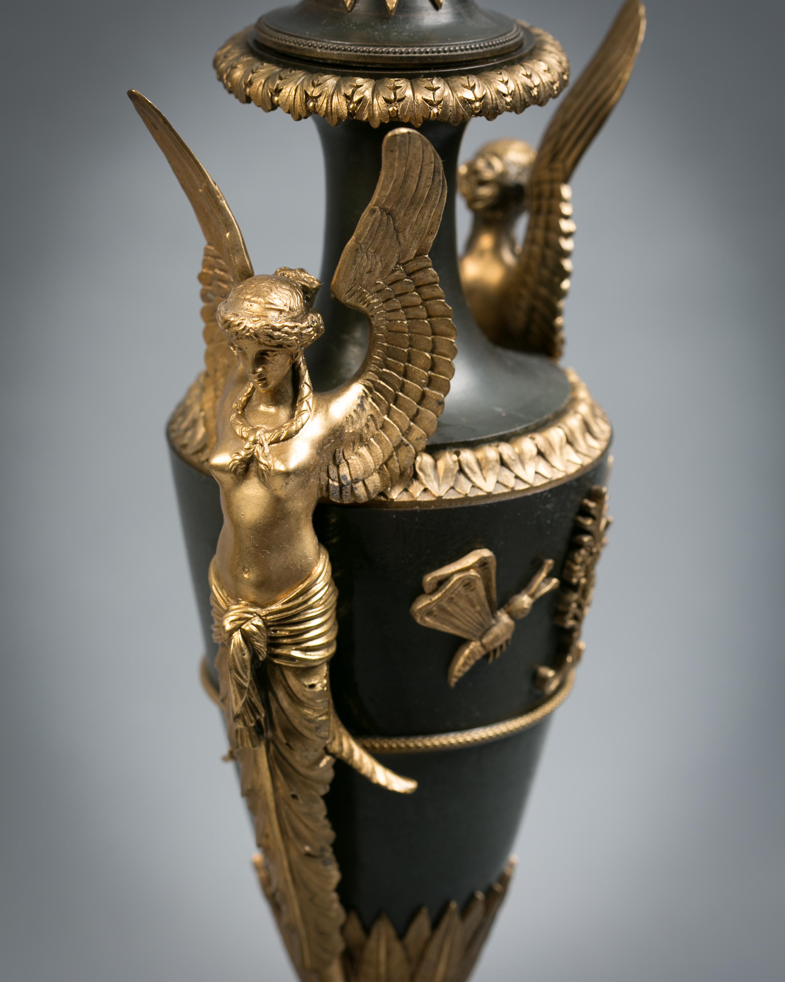 Pair of gilt and patinated figural bronze covered vases, French, circa 1830.