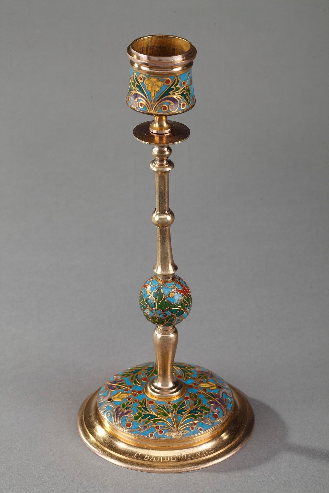 Pair of ormolu, or gilt bronze and champleve enameled candlesticks crafted by Ferdinand Barbedienne (1810-1892), one of the finest French craftsmen of the 19th century. The stems are supported by a circular base. The nozzle, base and central ball