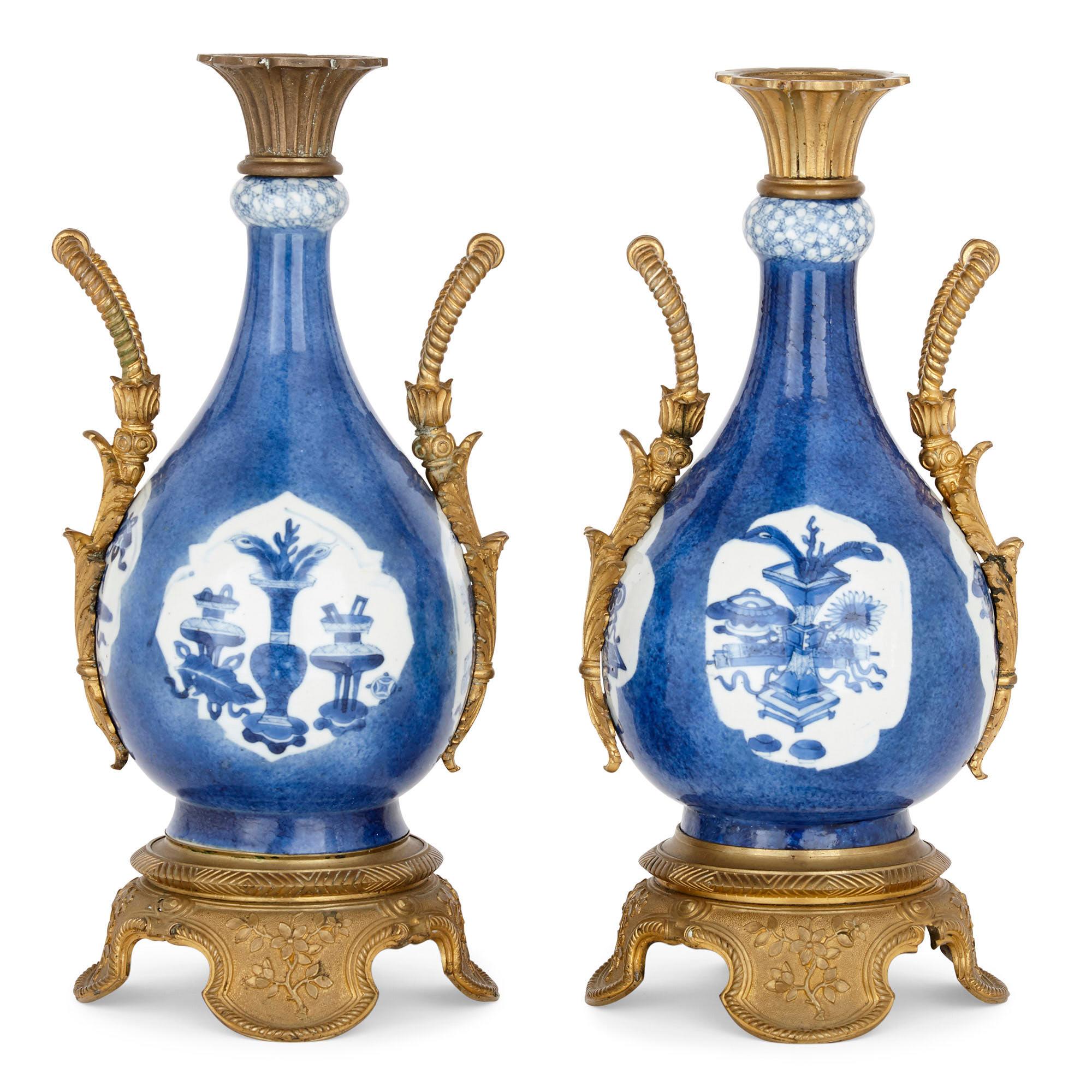 The vases in this pair feature the striking combination of Kangxi era (circa 1700) porcelain with later 19th century French gilt bronze. This type of combination—of Chinese porcelain with European, often French, additions, in this case gilt bronze