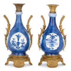 Pair of Gilt Bronze and Chinese Blue and White Porcelain Vases