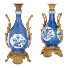 Pair of Gilt Bronze and Chinese Blue and White Porcelain Vases